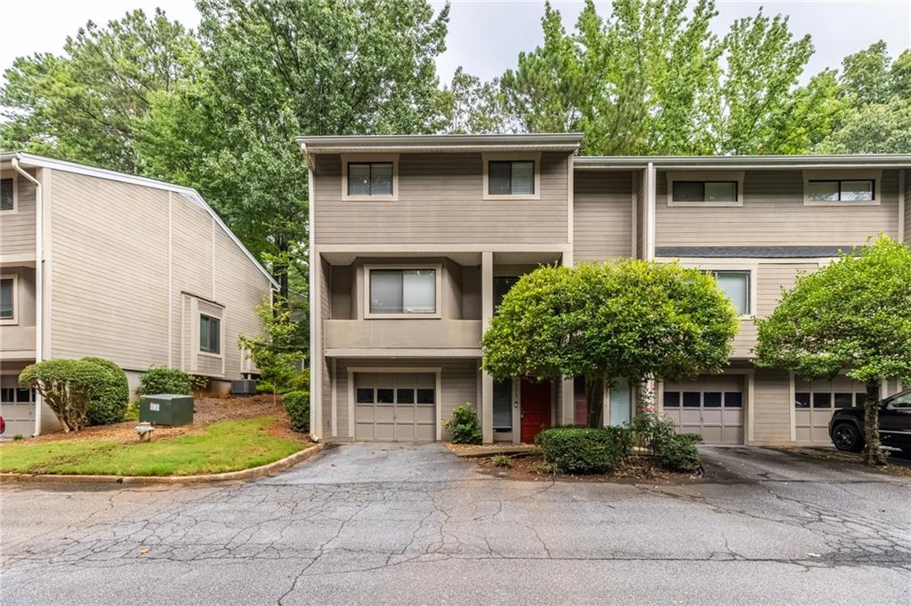 Welcome to The Woods, where comfort meets convenience in the heart of Marietta! This beautifully updated 3-story townhome features fresh interior paint, brand-new carpet, and new kitchen flooring, giving the entire home a modern and move-in ready feel. The bright, open living area is anchored by a cozy fireplace and flows seamlessly into the dining space, perfect for entertaining or everyday living. The kitchen boasts stainless steel appliances, ample cabinet space, and a breakfast area. Upstairs, the oversized primary suite offers a private balcony, walk-in closet, and ensuite bath, while additional bedrooms provide flexibility for guests, family, or a home office. Enjoy outdoor living with both a fenced patio and an upper-level balcony surrounded by greenery. The attached garage adds convenience and storage. Nestled in the desirable The Woods community, you’ll appreciate easy access to The Battery, Truist Park, shopping, dining, and I-75 for a quick Atlanta commute. This is the perfect blend of location, lifestyle, and value—ready for you to call home!