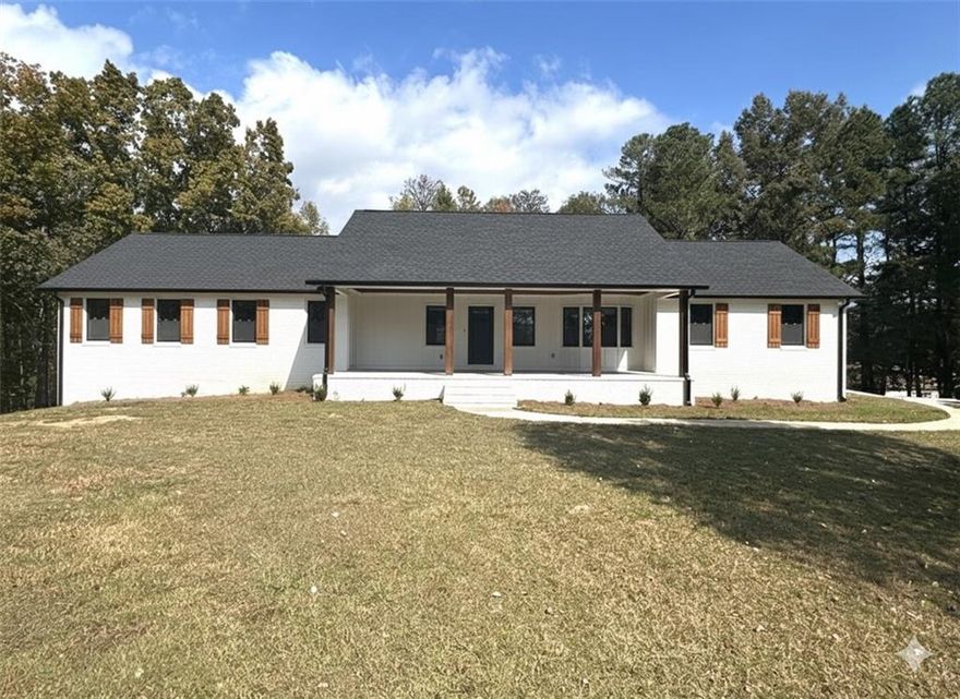 RENOVATED RANCH RETREAT on 2 Private Acres with Outdoor Fireplace!
Experience the perfect blend of modern luxury and serene country living. This stunning, fully renovated 3-bed, 2-bath ranch sits on a sprawling 2-acre private lot, providing the peace you crave while remaining minutes from schools and shopping.
The chef's kitchen is a showpiece, boasting elegant quartz countertops and upgraded white cabinets, opening seamlessly to a floor plan designed for effortless entertaining. Cozy up on the large covered front porch with beautiful wood accents or host unforgettable evenings on the covered back deck featuring a magnificent fireplace.
The primary suite is your private oasis, complete with a spa-like bath featuring a garden soaking tub, separate walk-in tiled shower, and double vanities. Inside, enjoy the low-maintenance beauty of luxury vinyl plank flooring throughout—absolutely no carpet! Need more space? The huge finished basement room is ready to be your rec room, home gym, or ultimate "man cave."

Don't miss this rare opportunity for acreage and high-end upgrades!