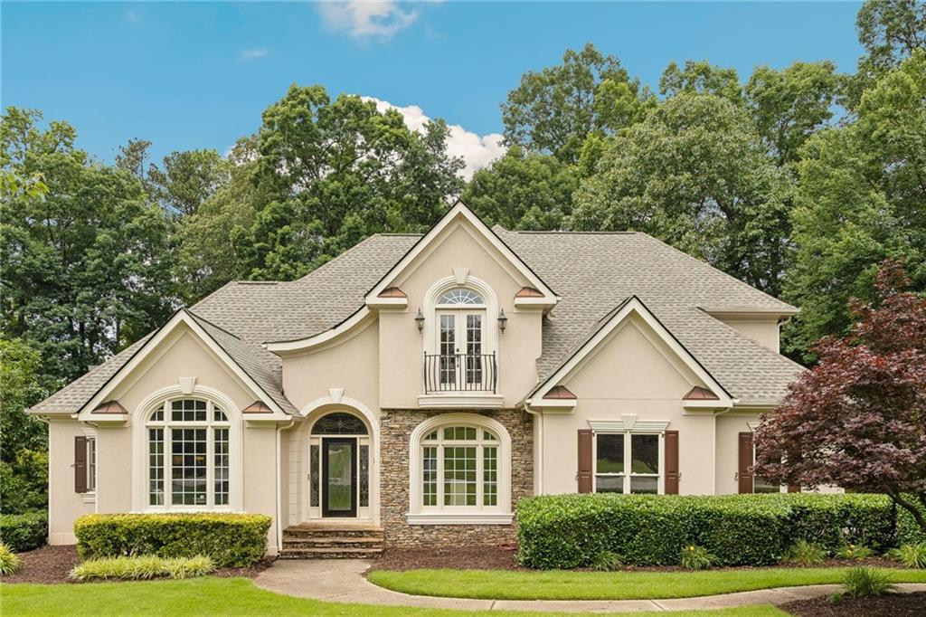 Welcome to the stunning former model home for Deer Lake! You’ll enjoy all the builder extras to include extensive, gorgeous trim work and molding, smooth ceilings & recessed lighting thru-out! Light & bright on all levels! Custom leaded glass front door, sidelights & transom! Luxurious Primary Suite on main with double-tray ceiling, spa retreat Bath, large walk-in shower with pebble reflexology floor, Kohler designer extra large soaking tub, double vanity & 2 walk-in Closets with shelving! Beautiful hardwood floors on main & custom Italian porcelain tile on terrace level! Amazing terrace level offers a custom built, incredible approx. 850 bottle Wine Cellar with custom granite pouring/tasting station, Kitchen, Full Bath, billiard table & fireplace all open to your covered patio! Main Kitchen offers a wine fridge, a NEW Refrigerator, NEW cooktop, NEW dishwasher, granite countertops, double deep sinks, large walk-in pantry & has an open layout! 2-story foyer & Living Rm with gorgeous fireplace impress the best! Conversation Rm/Office off foyer w/Built-ins! Ensuite BR upstairs with 2 additional BRs with walk-in closets! NEW roof in 2022! Freshly refinished 2-car garage flooring with wainscoting, insulated door & “quiet” Belt-Drive Lift Master opener with “MyQ” Smart App Technology! Wrap-around large driveway to 3rd car oversized garage for tandem parking, large enough for boat, etc. & has a built-in workshop! Generous closets & storage throughout to include 2 attic access points! Intercom system with radio thru-out! Inground irrigation system in front and back! This beautiful home is hard-coat stucco! Deer Lake has a gated entry and offers state-of-the-art community amenities that include Clubhouse, Olympic-size pool, fun children’s pool, 6 tennis/pickleball courts, basketball, Tot Lot, golf cart parking, gorgeous lake with fountain and fishing pier! Close to tons of shops & restaurants! This special home has it all!