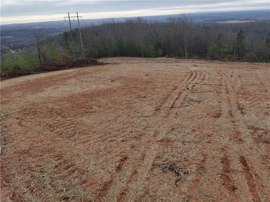 Breathtaking 9.358 acres lot with huge Mountain Views! 80 miles from Atlanta, Chattahoochee National Forest access, miles of walking, hiking and biking trails. Paved roads, giant lot is ready for your builder!