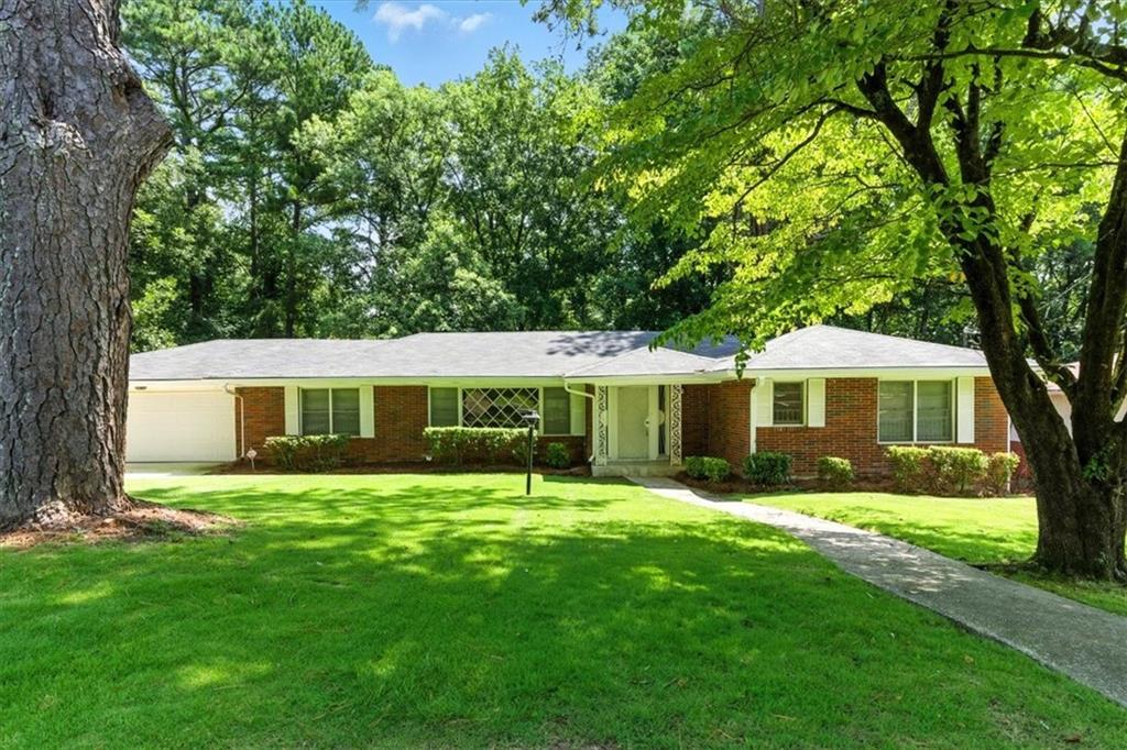 You will love this beautifully renovated ranch home with a finished basement, nestled in the historic charm of Collier Heights! This 5-bedroom, 3-bath ranch-style house features original hardwood flooring in all bedrooms, the foyer, and main living areas. The charming patio-style deck runs along the entire length of the family room and breakfast nook. It includes a brand-new full-size washer and dryer, and ceiling fans are in all bedrooms. Large front and backyard spaces are a rare find within the City of Atlanta! Located just 10 minutes from popular West Midtown, Atlanta University Center, and downtown, with easy access to 285 and only 20 minutes to the airport. Must have great credit and proof of income, call today for a easy showing!