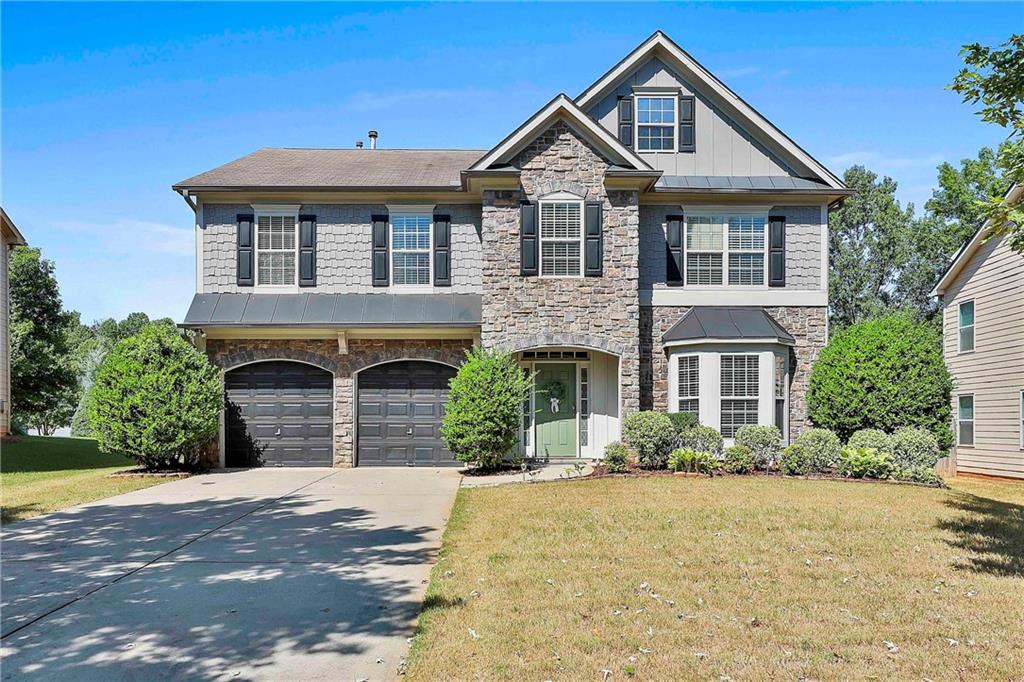 This beautiful 2 Story Home is located on cul-de-sac street in sought after neighborhood of Lakeshore Subdivision. Long driveway for plenty of parking. Enter through the front door into the welcoming foyer. To the right of the foyer is a formal living room with a large bay window, which can be used as an office, playroom or extra living space. Continue on into the formal dining room with coffered ceilings, charming wainscoting and enough space for a large dining table for family gatherings. Through the dining room is the spacious kitchen. Custom cabinets, and custom tile backsplash, solid surface countertops, an island make this room the center of the home. An informal dining area creates a smooth flow from dining to living and a pantry adds storage space. The cozy family room has a tile fireplace, large windows with a view out to the private backyard. A convenient half bathroom on the first floor. Up the stairs you will find an open loft area complete with large windows and ceiling fan, perfect for a teen hangout, playroom, office or many other endless options. Down the hall enter into the extra-large owner's suite through double doors. This room has space for a king-sized bedroom set, as well as a seating area and workout nook. Attached is owner's suite bathroom with separate tub and shower, water closet and double vanity and a large walk-in closet. The 3 secondary bedrooms have large closets for storage and plush carpeting. The secondary bedrooms share a large hall bathroom with shower/tub combo and large vanity for extra storage. The laundry is conveniently located on the second floor, between all of the bedrooms.  Outside find a spacious patio and   fenced in backyard, Perfect for entertaining. Located in the rear of the neighborhood, the home feels quiet and secluded. The community features a pool, tennis courts, playground and serene lake with a dock. Schedule you're showing TODAY, before this one is gone!  Directly off of the Bypass and minutes from Exit 44 for quick access to I85.