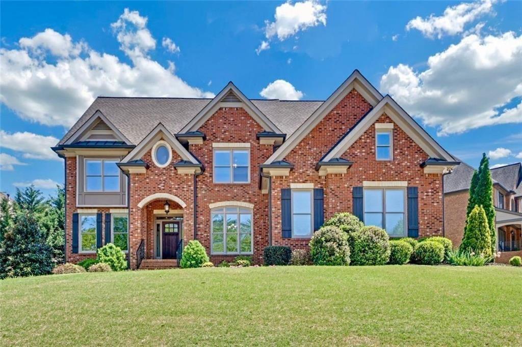 Welcome to 866 Coopers Ridge Path—an exceptional six-bedroom, five-bath residence nestled in the coveted Heritage at Grayson community. This four-side brick masterpiece harmonizes timeless elegance with thoughtful design, offering over 6,000 square feet of meticulously crafted living space. Step inside to discover a luminous, open floor plan adorned with custom carpentry, soaring tray ceilings, resurfaced hardwood floors, and an abundance of natural light. At the heart of the home, a chef-caliber kitchen awaits—equipped with a five-burner cooktop with easy-clean coating, double ovens, sleek stainless-steel appliances, and a custom quartz island built for both function and beauty. The adjacent formal dining room provides a refined setting for unforgettable gatherings. Every detail has been curated for luxury and ease—from new plumbing fixtures and low-energy lighting to premium carpeting throughout. The expansive Owner’s Suite offers a serene retreat, complete with a spa-inspired bath and oversized his-and-hers closets designed for effortless organization. Engineered for both comfort and efficiency, the home features dual brand-new HVAC systems, two 40-gallon water heaters replaced in May 2025, and a 50-year architectural roof with a transferable warranty. The oversized three-car garage includes custom cabinetry, a deep utility sink, and dedicated 20A and 240V outlets for all your needs. The fully finished terrace level adds incredible versatility, featuring a designer kitchenette, a media room with illuminated tray ceilings and a stone alcove, a built-in library, art or workstations, and a private guest suite with a solid wood sliding door. Additional enhancements include a custom full bath with cast shower, a reinforced storm shelter, spray foam insulation, and a dedicated HVAC system for the lower level. Outdoor living is nothing short of extraordinary—enjoy two cedar decks, one with a built-in fireplace and pizza oven, offer the perfect backdrop for entertaining or relaxing. Enjoy ambient deck lighting, under-deck and fireplace storage, paver walkways, a full irrigation system, and lush, curated landscaping that frames the property in natural beauty. Meticulously maintained by its original owners and located within a vibrant swim and tennis community in a top-rated school district, 866 Coopers Ridge Path is more than a residence—it’s a lifestyle. Welcome home to extraordinary comfort, craftsmanship, and timeless luxury.