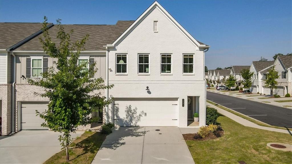 Don't miss this *end-unit* townhome in Tapp Farm! This 3 bedroom, 2 bathroom unit gets amazing natural light and features a main-level 2-car garage, tastefully updated interiors, and a versatile loft space perfect for an office. It does not back up to the main road, giving you extra peace and privacy. Enjoy the top-of-the-line community amenities including a pool and pickleball courts, plus direct access to the Silver Comet Trail right outside your neighborhood. This home is truly move-in ready and has been impeccably maintained for its next owner!