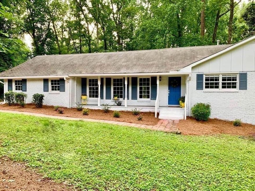 Savor the location and escape to this haven in downtown Alpharetta. Nestled on a quiet cul-de-sac on an acre of wooded land, this private oasis features renovated brick ranch with a revitalized open concept. Step inside and discover an open living space with an upscale country-chic style. The gorgeous chef’s kitchen is modern and bright, perfect for all your home cooking needs, and offers café-style seating options. Four spacious bedrooms, or use one for a den, playroom, or additional media room. Whether you’re enjoying a barbecue, the fire pit, or simply soaking up the sunshine, this outdoor space is sure to be a favorite spot. Walk just 1/2 mile to downtown Alpharetta, where you’ll find world-class shops, restaurants, galleries, and historical sites. Enjoy Brook Street Park and the town green, which hosts numerous outdoor concerts, festivals, holiday events, and art fairs. Don’t miss the weekly farmers’ market with over 130 vendors every Saturday morning. You can also explore nature with numerous biking and hiking trails, including the brand-new Alpha Loop. Other nearby attractions are the Ameris Bank amphitheater, Avalon, Wills Park Equestrian Center, North Park Tennis and Pickleball center, Waggy World Paw Park and Painted Horse Winery, just to name a few! Can be available as fully Furnished. Available mid-June.