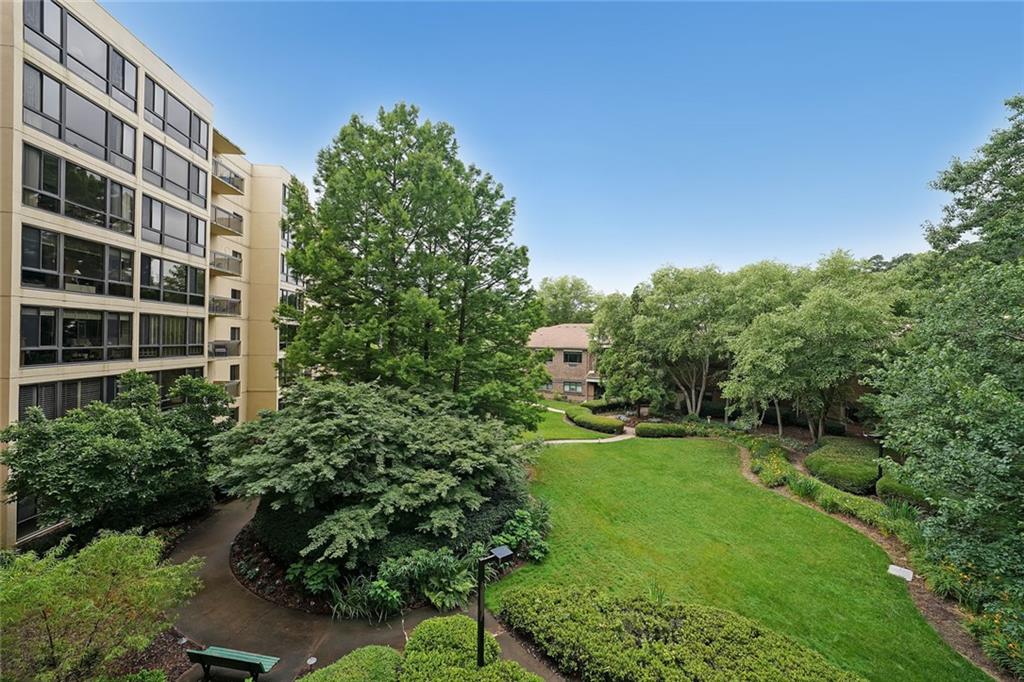 WELCOME TO UNIT #313! THIS TASTEFULLY UPDATED CONDO IS THE LARGEST ONE BEDROOM FLOOR PLAN AVAILABLE AT CLAIRMONT PLACE! THIS HOME FEATURES A SUNROOM AND A BALCONY OVERLOOKING THE BEAUTIFULLY LANDSCAPED COURTYARD! The Seller made some really nice improvements, including: French doors in the bedroom which open to your own private balcony which overlooks the serene landscape of the courtyard, luxury vinyl plank flooring throughout the unit, the wall in the entry way has been removed to open up the dining area, custom built storage cabinets, granite topped breakfast bar, added wall space in the Sun Room to hang more family pictures or art work, and a walk-in closet in the bedroom (which is unique for a one bedroom condo). Whoever moves into this condo will have a perfect view of the courtyard which is lovely anytime of the year! Clairmont Place is an INDEPENDENT 55+ senior living community located outside the city limits of Decatur! This community is conveniently located directly across the street from the VA Medical Center, near Emory doctors and the popular Toco Hill Shopping Center. The South Peachtree Creek PATH Trails runs right beside the Clairmont Place campus which provides easy access to Mason Mill Park, the Williams Library, Senior Center, and several miles of nature trails and boardwalks, all without having to cross any busy streets. A newer addition to Clairmont Place are the power charging stations for residents with electric vehicles. The monthly HOA fee includes: a meal per day, ALL utilities (including Cable and Internet), bi-monthly housekeeping, weekly linen service, maintenance, pest control, and transportation to nearby grocery stores and more. On the Clairmont campus, you will find a well-stocked library, indoor heated-saltwater pool, raised garden beds, large outdoor patio, onsite hair salon, exercise room, a gazebo with seating overlooking the lake, and so much more! This unit is vacant, clean, and ready for its new owner! Come visit today and fall in love with your new home at beautiful Clairmont Place! (Please note that some of the photos have been virtually staged, the condo is not furnished).