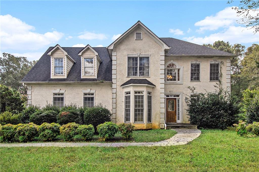 Welcome to this spacious and beautifully maintained 4-bedroom, 2.5-bath home located in a highly desirable area of Ellenwood. Sitting on over half an acre with no HOA, this home offers comfort, flexibility, and room to grow. Inside, you'll love the open-concept layout with plenty of natural light and generous living space—perfect for entertaining or relaxing with family. The updated primary bathroom is a true retreat, featuring a soaking tub, walk-in glass shower, and modern finishes. The partially finished basement includes a game room and office space, giving you extra room for work or play. With four spacious bedrooms, 2.5 baths, and multiple living areas, there's space for everyone. Enjoy the privacy of a large yard, the freedom of no HOA, and a location that offers easy access to shopping, dining, and major highways. Don’t miss this move-in-ready home in one of Ellenwood’s most sought-after areas!
