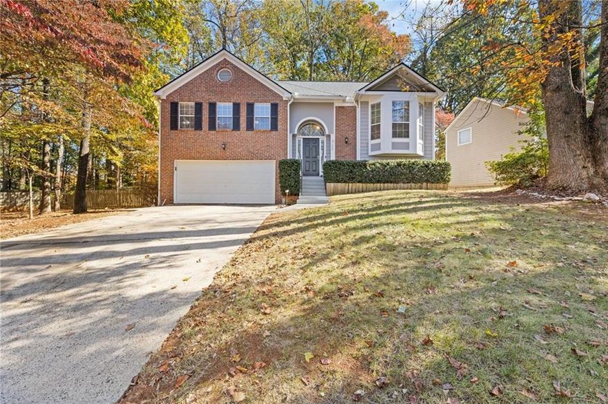 Welcome home to the largest floor plan in this highly desirable Milton High School neighborhood.  Taylor Oaks subdivision is an small but active subdivision. The HOA has numerous get togethers throughout the year with activities for all ages.  Located just minutes from Downtown Roswell, Alpharetta, Milton, Avalon, and GA-400, this home offers unbeatable convenience, top-rated Milton schools, and a low $65/year HOA. This traditional 2 story home features 4 bedrooms with 3 full baths, a family room with original wood floors , a real wood fireplace, dining room and living room.The open floor plan home offers a vaulted family room and an eat-in kitchen with stainless appliances and beautiful slate like flooring. . The primary ensuite features a newly renovated spa bath with stunning marble like tile and his and her closets. The light and bright secondary bedrooms also have large closets. The lower level includes a guest ensuite, secondary family room and workshop/storage area. Enjoy your screened back porch that overlooks the large private, fenced lot.  The exterior also includes a fully fenced backyard, a covered lower porch and additional lower decking. The two car garage has plenty of room for a workshop or storage.  Hurry, this wonderful home won't last long!