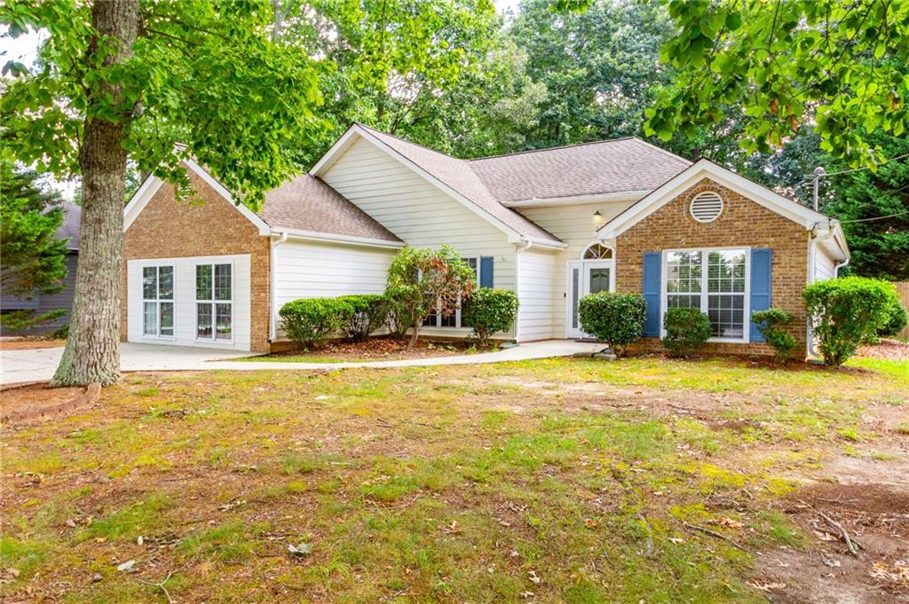 Hard-to-find STEPLESS ranch on a deep lot! BRAND NEW HVAC SYSTEM!!! Newer front door with wood flooring in foyer. Freshly painted family room with vaulted ceilings and wood-burning fireplace. Bright kitchen with repainted cabinets, granite countertops and stainless appliance package. Tile flooring in kitchen and breakfast area. Owner's sute on main floor with LVP flooring and a tray ceiling. Primary bathroom has it all. Large soaking tub, separate shower, water closet, double vanity sinks with granite countertops and additional storage cabinetry. Primary closet with dual shelving. Secondary bedrooms have LVP flooring and have ample space. Hall bathroom with tub/shower combo. Newly repainted laundry room. Huge bonus room can be a fourth bedroom or flex space! Pool has brand new liner and is ready for swimming. Freshly painted pool deck boards. Backyard is fully fenced with two storage buildings. Newly pressure washed exterior and surfaces. Long driveway and drive out gate for additional cars or larger vehicles. Come see this one today!