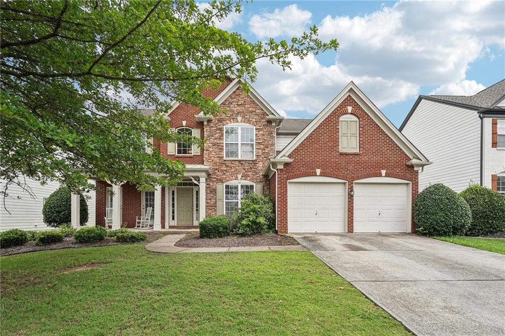 Welcome to this beautiful 5-bedroom, 3-bathroom brick home with stacked stone accents, in a quiet cul-de-sac in the highly sought-after Woodlands community offering so much potential. Boasting nearly 3,000 square feet of living space, this home offers exceptional value, abundant space, and access to one of the area's most amenity-rich neighborhoods. The charming covered front porch provides a warm and welcoming entrance, while the two-car garage with separate garage doors enhances curb appeal and functionality. Inside, you’ll find thoughtful design and impressive features, including a double sided cozy fireplace, generous storage options, and a spacious layout perfect for everyday living and entertaining with a bedroom and full bathroom on the main level! Step outside to a private patio, ideal for outdoor gatherings or quiet moments. And just in time for summer, you can take full advantage of the resort-style amenities that make Woodlands truly special, featuring a community pool with lifeguards, playground, volleyball, basketball, tennis and pickleball courts, and so much more! Even more exciting, the community has plans to expand its offerings with acres of parkland and miles of scenic walking trails, ensuring this neighborhood continues to grow in value and enjoyment. Don’t wait to explore this rare opportunity to own in one of the area’s most prestigious communities. With a little TLC you can live large, stay active, and enjoy the best of suburban living in Woodlands.