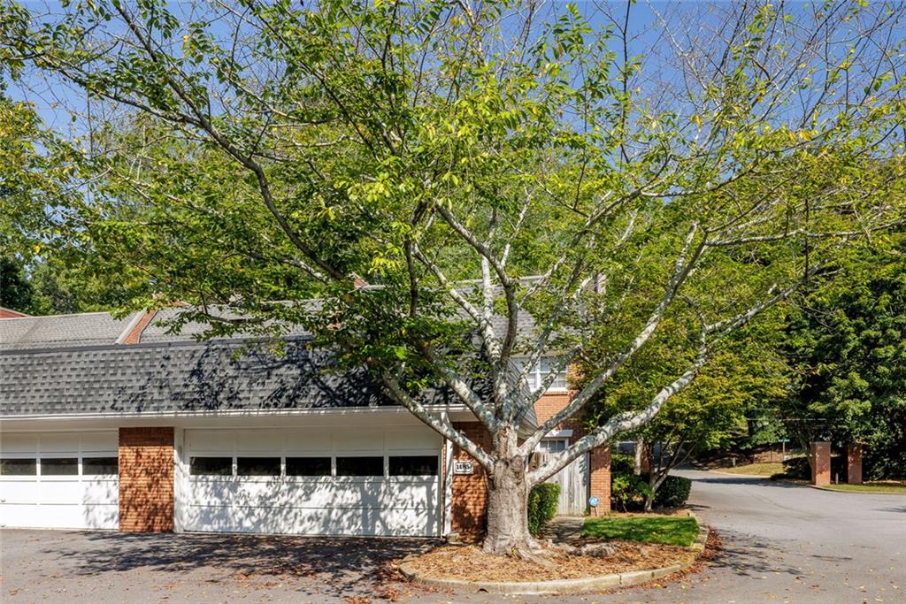 Rare Opportunity in Ashford Place – Exquisite Renovated End-Unit Townhome. Discover a truly exceptional offering in the sought-after community of Ashford Place. This absolutely gorgeous, fully renovated end-unit townhome is a rare find—impeccably maintained, thoughtfully updated, and move-in ready. Bathed in natural light, the home showcases hardwood floors throughout, custom finishes at every turn, and an Elfa closet system in every closet for seamless organization. Enter through a private courtyard into the spacious living room, where a granite fireplace with custom lighted built-ins sets an elegant tone. The living space flows effortlessly into the stunning new kitchen, designed for both beauty and function. White cabinetry, quartz countertops, and a glass subway tile backsplash pair perfectly with a large center island with breakfast bar, stainless steel appliances, and thoughtful details such as a gas cooktop with pot filler, vent hood, coffee bar, and pop-up electrical socket. Multiple pantries, a mudroom side entrance with umbrella stand from the garage, and abundant storage add convenience, while the open dining area leads to a large private deck, perfect for entertaining. A main-level office provides the ideal work-from-home retreat, while the upper level boasts an oversized owner’s suite with a sitting room and a showstopping spa-inspired bath. Dual vanities, a free-standing soaking tub, and an expansive shower create a luxurious retreat, complemented by a spectacular walk-in closet with leaded glass door and a professionally designed closet system with custom cabinetry. Two additional bedrooms share a beautifully updated hall bath, with a laundry room conveniently located upstairs.The terrace level extends the living space with a wet bar illuminated by pendant lighting, a versatile media or playroom, a bedroom with full bath, an exercise room, and abundant storage, all opening to an additional outdoor living area. The oversized two-car garage offers even more storage, along with a floored attic, Ecobee Smart thermostats, and a Flow Logic leak detection system for peace of mind. Residents of Ashford Place enjoy a sparkling pool, beautifully maintained greenspace, and a warm community setting that feels both private and welcoming. Plenty of guest parking available. Perfectly positioned in the heart of Brookhaven, this townhome offers easy access to top-rated schools including Montgomery Elementary and Marist. Outdoor enthusiasts will love walking to Murphey Candler Lake with its trails, nearby Blackburn Park and Tennis Center, and Cowart YMCA. Just minutes from shopping, dining, and Chamblee’s vibrant mid-city district, with convenient access to I-285 and all that Atlanta has to offer, this home combines refined living with everyday convenience.