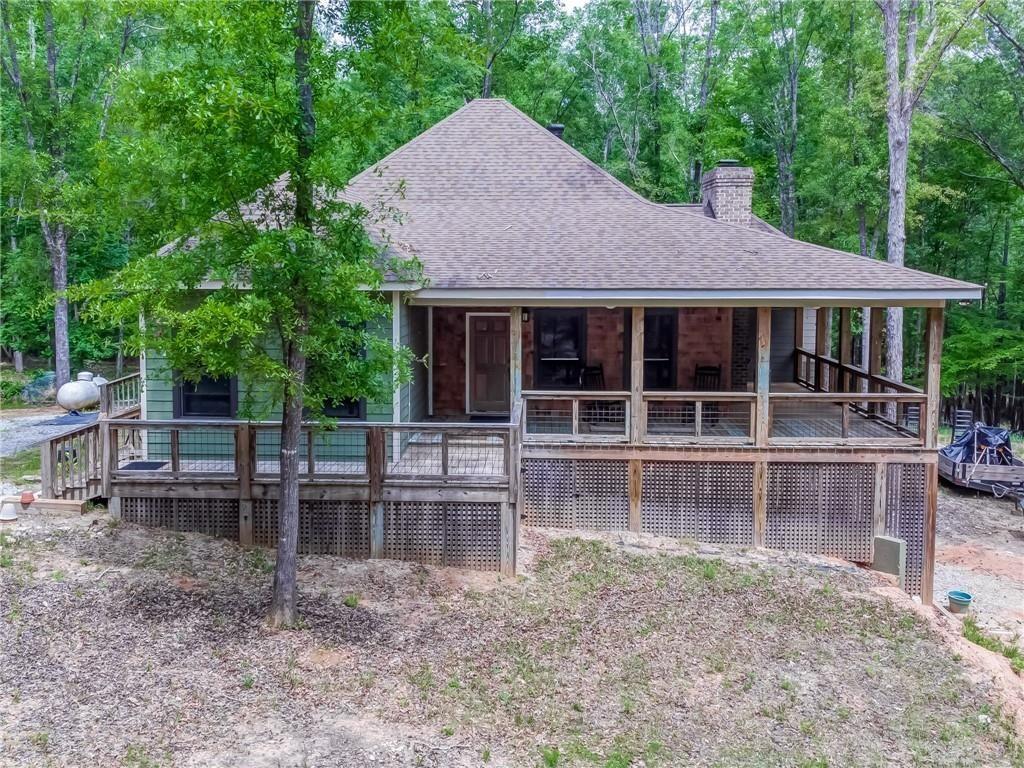 Discover this charming single-family home, built in 2017, where modern comfort meets rustic charm. Nestled on a sprawling 18.84-acre estate, the property offers a rare blend of lush wooded surroundings, open land, and the soothing presence of the North Oconee River. Inside, the thoughtfully designed floor plan features 2 bedrooms and 2 full bathrooms, with the master suite conveniently located on the main level. The cozy family room, complete with a gas-log fireplace, creates a warm gathering space, while the kitchen comes fully equipped with a dishwasher, electric range, microwave, garbage disposal, and solar hot water system. Additional comforts include central heating and air, ceiling fans, hardwood, carpet, and ceramic tile flooring, plus extras like a double vanity, walk-in closet, foyer entry, and attic stairs. The main-level laundry room adds everyday convenience. Step outside to your private deck or porch, the perfect spot to relax, entertain, or simply enjoy peaceful river views and quiet moments surrounded by nature. Ideally located, the home is just 1 hour north of Atlanta, 20 minutes from Athens, 19 minutes from the University of Georgia, and only 9 minutes from Jefferson town square with quick access to I-85. Families will appreciate the highly regarded Jefferson City School System, ranked among the best year after year.
Whether you’re a nature lover craving privacy, a professional commuting to Athens, or seeking a serene retreat-style residence, this home offers the best of both worlds—secluded living with convenient access to modern amenities and regional hubs.