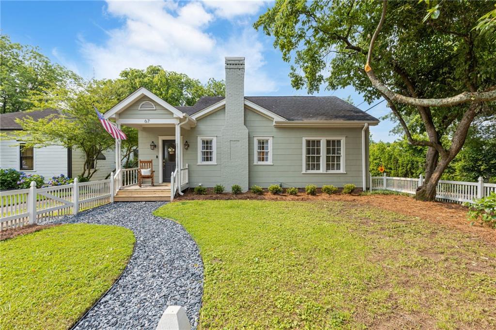 Welcome home! Step into the timeless charm of this beautifully updated 1928 bungalow, ideally situated just minutes from the heart of the charming Marietta Square and less than a block from Henry Park. This adorable cottage seamlessly blends vintage character with modern comfort, offering original wood floors, elegant updates, and a welcoming neighborhood feel. The thoughtfully renovated kitchen is such a treat, featuring sleek quartz countertops, custom red oak cabinets, a gas range, stainless steel appliances, and a pantry. The bathroom has been tastefully remodeled to honor the home’s historic roots, complete with period-inspired fixtures and stylish new tile. Another nod to days gone by are the original wood doors and vintage hardware. Enjoy peace of mind with major updates already completed, including a brand-new HVAC system, water heater, updated fireplace with vented gas logs and recessed lighting. Outdoors enjoy new exterior paint, gas lanterns on the front porch, and a fully fenced backyard—perfect for entertaining, pets, or gardening. An outbuilding provides additional storage or potential workshop space. This home truly affords both quiet neighborhood charm and exciting city life! Located just steps from green space, local shops, award winning restaurants, and all the vibrant art, culture and community the historic Marietta Square has to offer, you will not want to miss this gem! Excellent proximity to Wellstar Kennestone Hospital, Kennesaw Mountain National Battlefield Park and I75. Fantastic AL Burruss neighborhood elementary school.