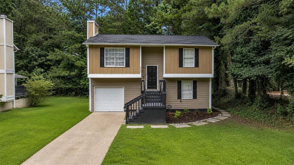 Photo of 5300 Forest Downs Lane, Atlanta, GA 30349 (MLS # 7786283)