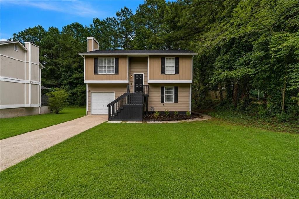 Photo of 5300 Forest Downs Lane, Atlanta, GA 30349 (MLS # 7786283)