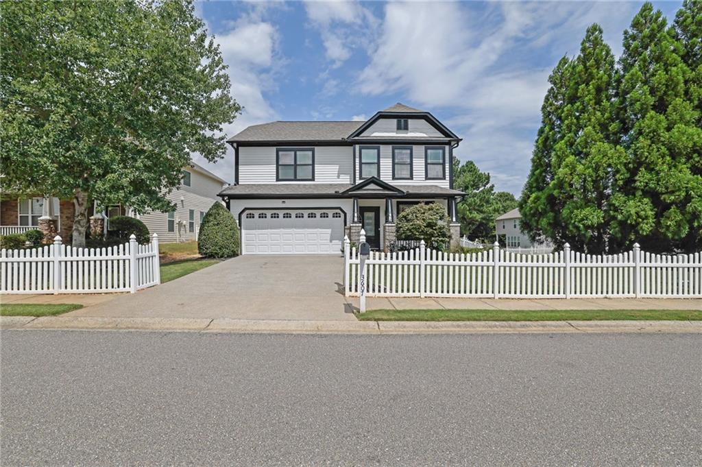 Discover Your Dream Home in a Quaint Picket Fence Neighborhood!
Step into this charming 4-bedroom, 2.5-bath Craftsman-style home, bursting with character and natural light. Located in a picturesque community, this property boasts an open floor plan, perfect for entertaining. The stylish kitchen features crisp white cabinetry, sleek stainless-steel appliances, and plenty of counter space. A separate dining room offers additional space for family / friend's gatherings. Cozy up by the fireplace in the great room or unwind in the serene backyard oasis. Recent updates include a freshly painted interior, brand new exterior paint with a sleek modern look featuring crisp whites and deep blacks, new vinyl flooring, brand-new carpet, and modern lighting throughout. The spacious primary suite is a serene retreat, while the three secondary bedrooms offer comfort and flexibility. Enjoy the expansive fenced-in backyard, one of the largest in the neighborhood, perfect for relaxation or play. Please note that the lot lines extend beyond the fence. Plus, the home features a water softener system for added convenience and comfort. With convenient access to GA-400 and proximity to The Collections at Forsyth, Big Creek Greenway, and top-rated Forsyth County schools, this home offers the perfect blend of tranquility and accessibility. Schedule a showing today and make this house your home!