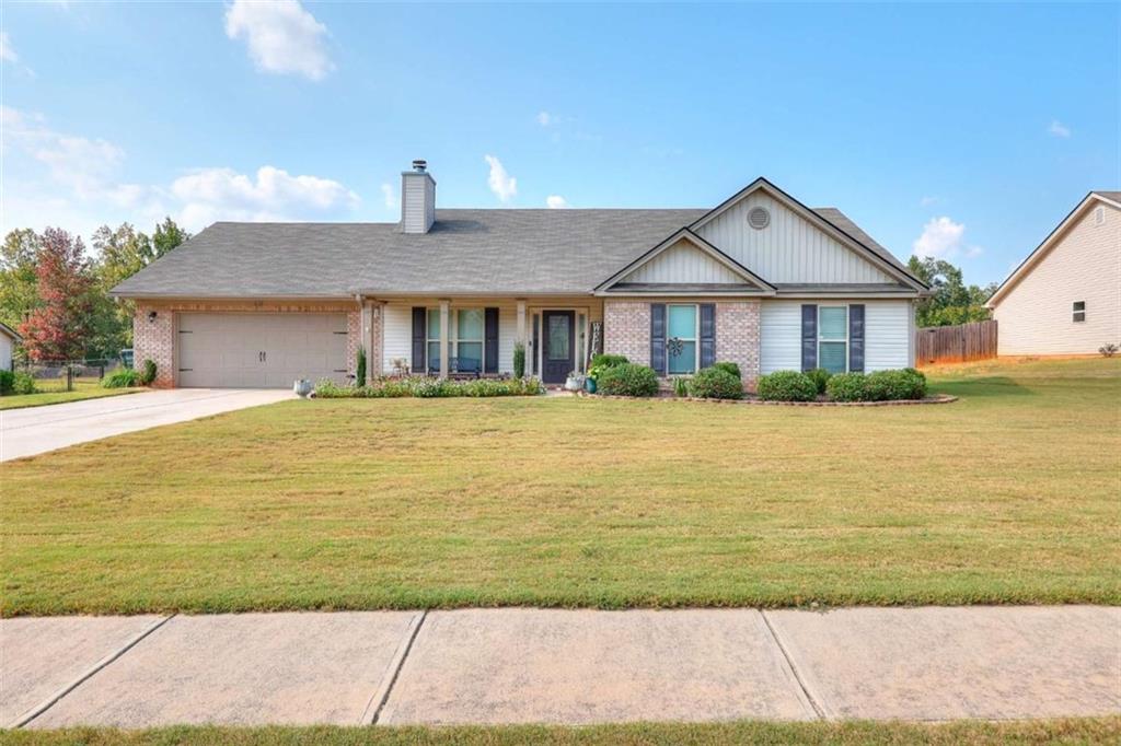Welcome to Willow Brook in Monroe, Georgia. A beautiful and spacious four-bedroom, three-bathroom home for sale in Walton County that perfectly blends comfort, style, and functionality. As you enter, you're greeted by an inviting living room with vaulted ceilings, custom built-in shelving, and a cozy fireplace that creates a warm, central gathering place. The open-concept floor plan flows seamlessly into the dining area and kitchen, where you'll find granite countertops, a large center island, ample cabinetry, and modern finishes, making it ideal for meals and entertaining. The primary suite is a private retreat with a tray ceiling, walk-in closet, and spa-like ensuite bath featuring dual vanities, a corner soaking tub, and a separate shower. Three additional bedrooms are generously sized and versatile, perfect for a home office, guest space, or flex room. With three full bathrooms, there's space and convenience for everyone. Step outside and enjoy the peace and privacy of country living while still being close to everything you need. This home offers a quiet setting but is just minutes from shopping, dining, and local events in downtown Monroe, GA. You'll also find easy access to Loganville, Athens, and surrounding communities, making this location convenient for commuters while still offering small-town charm. All will appreciate that this property is located in the Walton County School District, close to Monroe Area High School, elementary and middle schools, and area parks. The combination of excellent schools, a central location, and a thoughtfully designed home makes this property a standout in today's market.