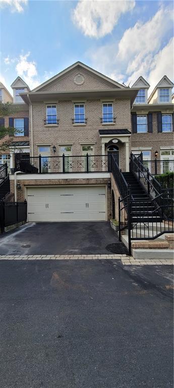 BUFORD CITY SCHOOLS! 3 bedroom and 2 1/2 bath townhome in the sought after gated community of Buford Village Walk. Open concept floor plan with 2 living spaces. Kitchen features granite countertops and stained cabinets. Upstairs you will find the master bedroom with his and her closets along with 2 secondary bedrooms which share a jack and jill bathroom. This unit features a spacious front porch and also a private rear porch.