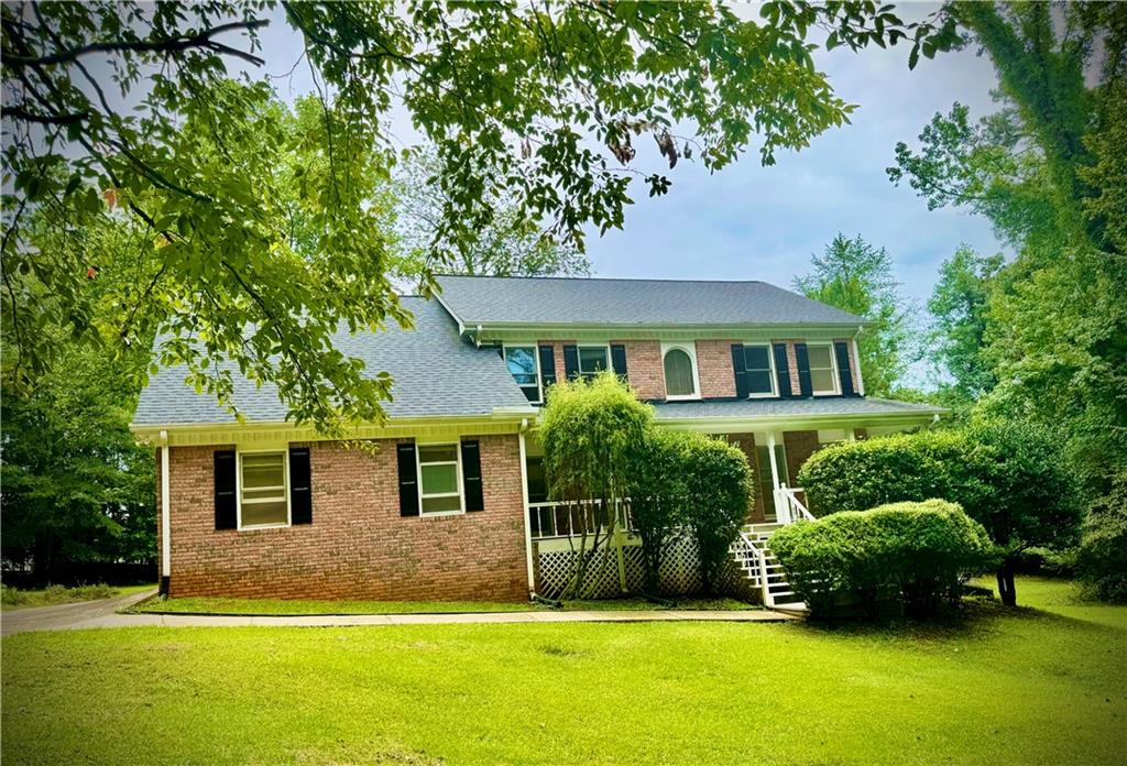 Executive Living at an Entry-Level Price! This beautiful, solidly-built custom home is a must-see, peacefully situated on a quiet cul-de-sac in one of Conyers' most desirable neighborhoods. With 4 spacious bedrooms, 4 full bathrooms, a versatile bonus room, and a large basement featuring its own full bathroom and separate entrance, this home offers endless possibilities for families, guests, or even rental income. Inside, you'll love the warm and inviting family room featuring a cozy fireplace and an elegant staircase leading upstairs. The formal living and dining rooms are perfect for hosting, while the bright and open eat-in kitchen makes everyday dining a pleasure. BUT WAIT... THERES MORE! Step outside onto the charming covered front porch or relax or the expansive patio deck overlooking your flat, usable backyard—perfect for gardening, entertaining, children's play area, or even your future pool. With a long driveway providing ample parking and a convenient attached garage, coming home has never been easier. ALSO... the owner states the lot can potentially be subdivided, allowing for another home to be built—perfect for a home for the inlaws, a guest house, an investment, or to increase future value. Enjoy easy access to Highways 212, 138/20, and Interstate 20, putting shopping, restaurants, entertainment, and top-rated schools just moments away. Welcome home to this vibrant community—make this incredible opportunity yours today!