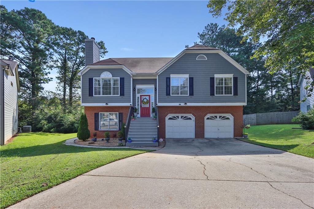 Welcome to 1000 Carlton Way SW in Marietta – Where Comfort Meets Convenience
Tucked away on a quiet cul-de-sac, this inviting 4-bedroom, 3-bath home blends charm, space, and everyday convenience. From the moment you step inside, the gleaming hardwoods, and a cozy fireplace create a warm, welcoming atmosphere.
The spacious kitchen is designed for both cooking and connection, flowing effortlessly into the dining area—perfect for family meals or hosting friends. The large primary suite is a true retreat with vaulted ceilings, a private en-suite bath, and a generous walk-in closet. A flexible split-level layout offers a lower-level bedroom with full bath, family room, 2nd kitchen and a private entrance—ideal for guests, a home office, or multi-generational living.
Step outside to your private deck and enjoy peaceful mornings with coffee or relaxed evenings overlooking the yard. With a two-car garage, classic brick and hardiplank exterior, and low-maintenance lot, this home offers both style and function.
The location seals the deal—just minutes from shopping, dining, schools, and major highways, plus:
10 minutes to the boutiques and restaurants of Vinings, West Village, and Smyrna Market Village, 15 minutes to The Battery for Braves games, concerts, and year-round entertainment. This home delivers the best of suburban living with quick access to all that Marietta and Atlanta have to offer. Don’t miss your chance to make it yours—1000 Carlton Way SW is ready to welcome its next chapter.