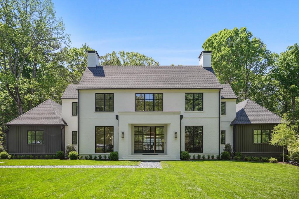 This beautiful new construction has it all! Amazing architecture by Castro Design, built by Derazi Homes, one of Atlanta's premier custom home builders, in a sought-after location in Buckhead. INCREDIBLE FINISH LEVEL AND DETAILS! The main floor features a large open floor plan with a grand foyer, formal dining room, and study. The stunning kitchen with a large marble center island, custom cabinetry, and Wolf range overlooks the fireside family room with large iron doors opening to the covered patio with fireplace. Patio has built in electronic screens and two ceiling heaters for 365 day outdoor use. Gorgeous flat walkout backyard and a pristine pool with good size play yard. The main floor also features an owner's suite with large his and her closets, gorgeous marble bathroom with floating cabinets and backlit mirrors, a secondary office space, laundry room, and mudroom off the three-car garage. Four bedrooms with en suite bathrooms and flex/play space are upstairs with additional laundry. The lower level is partially finished and has potential for one bedroom, 1.5 bathrooms, movie theater, wine cellar, and playroom/gym area. Short distance to Jackson Elementary School and minutes to Chastain Park. Amazing finish level inside the home with Arteriors lighting, Emtek hardware, all marble countertops and tile in every bathroom from Ciot. A must see. Move in Ready.