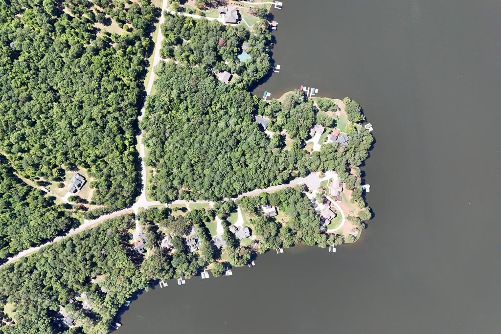 BUILD YOUR DREAM HOME on an Exceptional Lake Oconee Lot in The Woods of Lake Oconee Subdivision. Nestled among newly constructed luxury homes, this expansive, relatively flat lot with Lake Views provides the perfect canvas to create lasting memories. Enjoy the best of both worlds privacy and proximity. Whether you're a boating enthusiast or a golf aficionado, you'll appreciate the nearby public boat launch and access to top-tier golf courses. Plus, with excellent dining options just a short drive away, this location is poised to offer an unparalleled lifestyle on Lake Oconee. THE LAND IS GRANDFATHERED AND NOT SUBJECT TO HOA RESTRICTIONS.