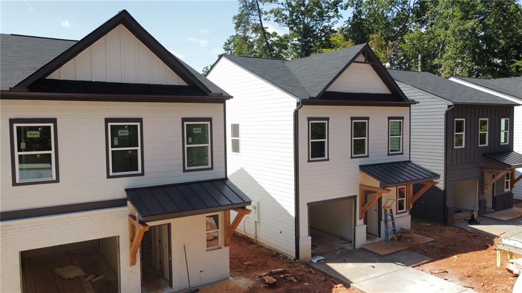**Seller Incentive - $16,000=4.75 permanent FHA/VA buydown. Any Way You Want IT!****Welcome home to The Cottages at Jackson Heights!** This beautifully designed Khloe Elevation B floor plan offers an open and inviting layout with stylish finishes throughout. 9' Ceilings on both levels. Enjoy a spacious two-story home with a 1-car garage and a covered rear patio that spans the entire width of the home—perfect for outdoor relaxation. Durable LVP flooring covers the entire main level. The kitchen features 42” upper cabinets with under-cabinet lighting, solid surface quartz countertops, and a full suite of all-electric appliances. Cozy up in the family room with an electric fireplace. This smart home includes a Wi-Fi-enabled thermostat, garage door opener, and touchscreen deadbolt for added convenience. The home showcases all-black plumbing and door hardware for a modern touch. Plus, enjoy the benefits of 100% James Hardie siding for a low-maintenance exterior. Stackable washer/dryer and 2” blinds are included. Come experience elevated townhome living!
Wifi thermostats and keyless entry system. Well appointed kitchen with 42" upper cabinets, soft close with under cabinet lighting.