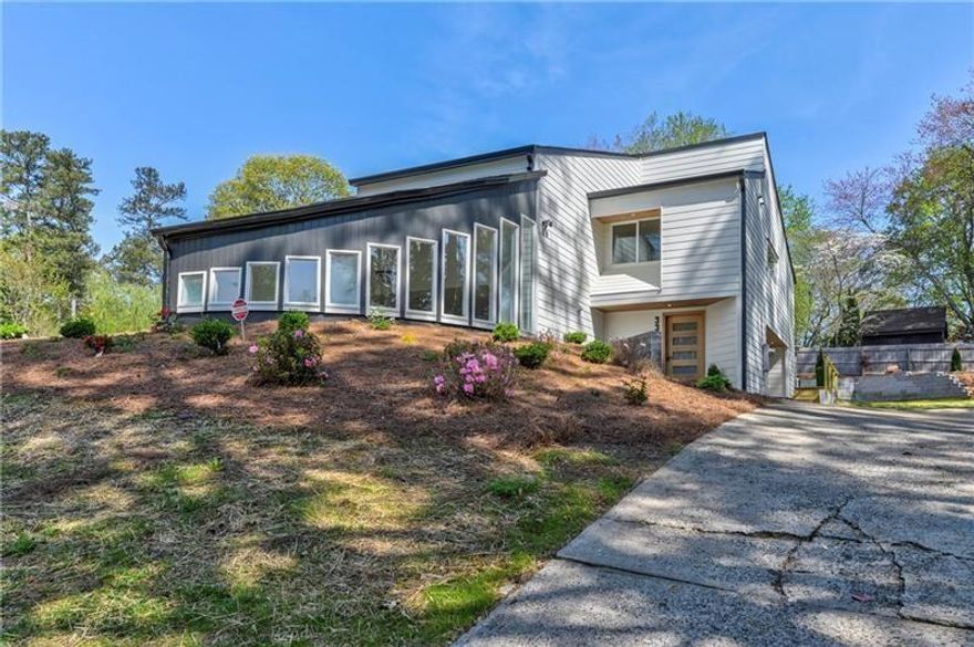 THE HOUSE ON A HILL! Don’t miss this STUNNING Renovation in one of East Cobb’s Top Swim/Tennis Communities served by Top Schools! From the beautiful Curb Appeal with Modern Garage Door. Designer Kitchen, Elegant-Open Flow, Spacious Owner’s Suite on Main, Updated Flooring and Lighting throughout and the exceptionally Large Back Yard with space for a pool, you will LOVE this amazing home! The Kitchen features Custom Cabinets, GORGEOUS Quartz Counters and Backsplash, a nice sized Island with Waterfall Design and Counter Seating, all new appliances with an impressive Stainless Steel Vent Hood/custom, fabulous Lighting, and a Breakfast Area AND Sitting Room/Keeping Room that opens to the large backyard Decks! What an incredible space for cooking and entertaining! The elegant Great Room has a unique appeal and is so large that it accommodates a comfortable, spacious Living Space AND a Baby Grand Piano. Start and end each day in the serene privacy of your Owner’s Retreat – tucked on it’s own corner of the home and featuring a Custom his/her Closet and a Spa-like MAGNIFICENT Master Bath. Relax and play in the MANY Getaway spaces throughout this happy home, including a bedroom being used as a FUN Movie Room UPSTAIRS and a large Terrace Level with two separate Living Areas, and to Top it off you have a gorgeous walk in WINE CELLAR, and SPACE for a home Gym at the top level! Entertain and Grill Out or simply Relax and Rest on your Double Decks overlooking over half-acre lot! So much space to play outdoors! And a large portion of the back yard is Fully Fenced and convenient for pets! This home features high-end finishes in an exquisite blend of Contemporary/Modern Design. Somerset is a premier Swim/Tennis Community known for friendly neighbors and fun community events. Near fabulous restaurants/shopping, I-75/285, GA400. Easy access to The Braves/Truist Park, Buckhead, Perimeter, Sandy Springs, Historic Roswell, Marietta Square, East Cobb Park, and miles of glorious Nature Trails in the Chattahoochee Preserve and Roswell River. TOP Schools recognized for excellence. WOW! Hurry in!
