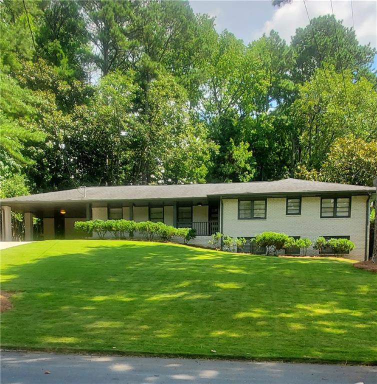 This stylish 1960s Northcrest ranch blends timeless charm with all the modern updates. Hardwood floors, designer lighting, neutral paint colors, and an open, airy layout create a warm, cohesive vibe throughout. A classic 4 Bedroom/2 Bathroom Ranch Style home = one level living with a Master on the Main! The updated kitchen features quartz countertops, custom cabinetry and stainless-steel appliances, and flows easily into the living and dining areas - ideal for everyday living and entertaining. A fully renovated bathroom (2022) adds move-in-ready appeal, and recent upgrades to plumbing & electrical systems provide added value and peace of mind. Walk through the sliding glass doors to enjoy your morning coffee on the spacious screened-in porch overlooking a private, fenced backyard. The large partially finished basement offers endless potential, storage and plenty of space for a playroom, man cave, home gym and a workshop. This home checks all the boxes! Set in the Historic Northcrest neighborhood with access to the Swim & Tennis club, you can live in a neighborhood known for its mid-century character and strong sense of community! You’ll also love the location - just minutes from downtown Chamblee and Tucker, the growing Assembly Yards development, and the exciting mixed-use site under construction at Buford Highway. Convenient to shopping, dining, and major highways, this home combines comfort, style, and an unbeatable location. Don't miss this opportunity, it's a must see!