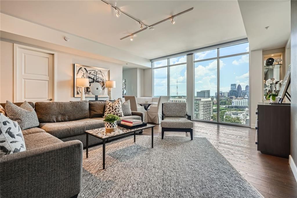 Spectacular designer furnished and customized sixteenth floor condominium with breathtaking midtown skyline view. Fabulous open kitchen w stainless steel Viking appliances including a gas cooktop. The cabinets are crisp
white with stone countertops and a large island with seating. There are
two large bedroom suites with luxurious ensuite baths. A third room is
currently furnished as a comfortable den but is often used by other
homeowners as a third bedroom with adjacent, full bath. A very rare
opportunity to step into a lovely, carefree life style.
The Brookwood has the amenities of a five star resort.
The Club House has a double sided fireplace, beautifully
furnished club rooms, a pool room and catering kitchen.
There is a state of the art fitness center. A large salt
water pool has an adjoining grilling area including "Big
Green Eggs" and gas grills. There is a 24 hour conceirge,
2 deeded parking spots in secured garage. If you do not
need furniture the condo may be leased empty.