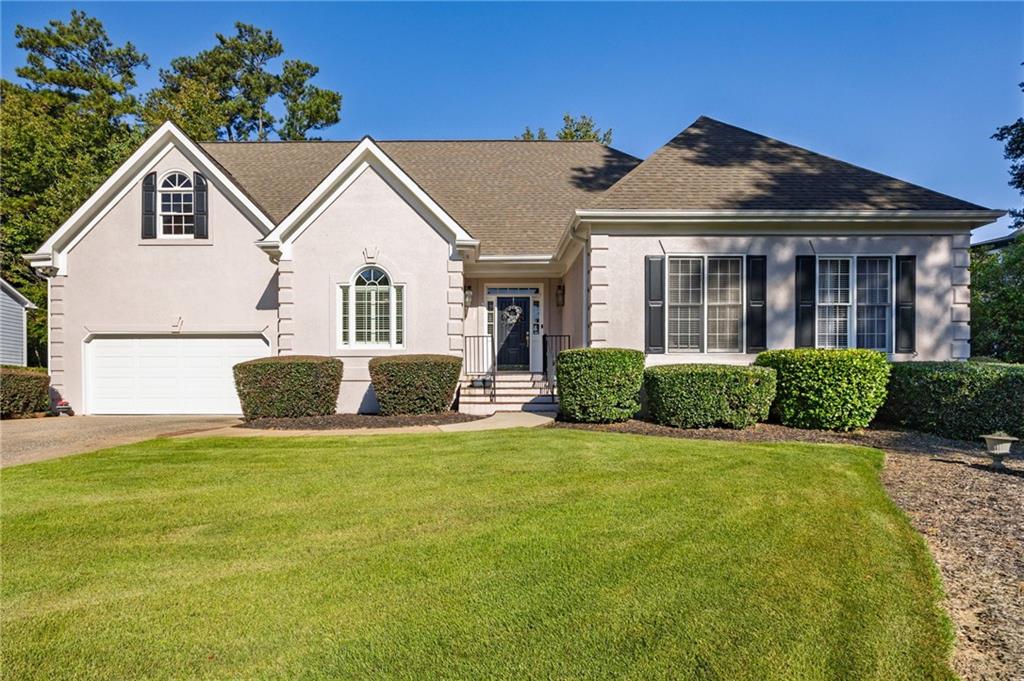 ***Welcome Home*** First time ever on the market! Your search may just be over with this one! The Crabapple lifestyle is waiting for you!
Custom Hardcoat Stucco, immaculately maintained elegant Ranch style home on a quiet street, appealing floorplan with tons of natural light- beautiful, private corner lot with wonderful landscaping - 3 bedrooms downstairs - large unfinished flex area upstairs off the kitchen(heated/cooled/stubbed for full bath and has power) - only a few hundred yards away from dining, shopping, festivals, breweries and concerts! Award winning schools, in a prime location! Call today to schedule your showing.