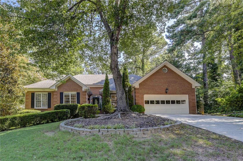 Welcome Home! This gorgeous ranch on a finished basement offers space for everyone and everything. As you enter the front door you see open spaces all the way through to the private decks and back yard. Huge dining room and front den that leads into the updated gourmet kitchen, breakfast room and great room...all with beautiful views of the lush backyard. The oversized primary suite features a spacious main bedroom with lovely bath offering a separate soaking tub, shower, dual vanities and walk-in closet. The main floor is finished with two additional bedrooms and a full bath. The finished terrace level has space galore...with a huge home theater room, bedroom, full bath, oversized office, additional living spaces, project room, cedar closets and additional storage. Such great space and so many possibilities. And when you go outside you have a wonderful back yard with so many options.
Location, Location, Location...this property is conveniently located near 316 & I-85 with great schools and all the restaurants and shopping you can imagine.
You must come see this beautiful home before someone else makes it their new home.