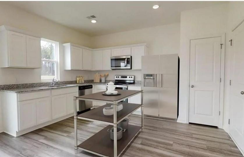 New Home boast the latest styling of beautiful finishes - The beautiful Copernicus plan features 4 bedrooms, 2.5 baths, 1801 Sq Ft, GRANITE countertops, STAINLESS STEEL Appliances, white cabinets, gorgeous, expansive kitchen, pantry, walk-in closets, and laundry room. The community features Sidewalks and Streetlights! We are open daily Monday - Saturday 10:00 AM - 6:00 PM and on Sunday's 11:00 AM - 6:00 PM. $2,500 earnest money deposit is required. Ask about our current promotions with Our Participating Lender! Call Today Matthew Taylor 770-292-0778