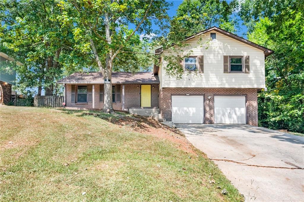 Incredible Opportunity in Jonesboro! Whether you're looking for your next investment or a forever home, 1598 Flicker Rd has it all. This spacious 4-sided brick beauty features 4 bedrooms and 2.5 baths, including a basement with a bonus room that can be used as a bedroom, half bath, and private exterior access — perfect for multigenerational living or rental income. Enjoy hardwood floors throughout, a sunroom for relaxing, a large equipped kitchen, formal dining room, and your very own in-ground pool ready for summer fun! The property sits on a full 1-acre lot (adjacent lot included in the sale), giving you space to grow, garden, or build. With an attached garage and easy access to shopping, dining, and major highways, this home offers versatility, value, and serious potential. Don’t miss your chance to own a property that fits both lifestyle and investment goals! Some photos have been virtually staged to illustrate potential furniture placement, the home is not currently furnished as shown.