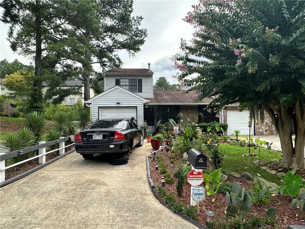 Welcome to this rare end-unit townhome, a standout with a coveted 1-car garage—a unique find in the area! This 4-bedroom, 2-bath home offers new LVP flooring throughout, with easy-care ceramic tile in the kitchen and bathrooms. The main-level primary suite includes a full bathroom for convenience, while two additional bedrooms and a full bath upstairs provide privacy and flexibility. A fourth bedroom on the main level is perfect for a home office, den, or additional bedroom. Enjoy both front and back patios—the front for your morning coffee, the back for relaxing evenings. With a full bathroom on each level and plenty of paved parking, comfort and convenience are key. Located near shopping, dining, and major highways, this townhome is ideal for those seeking both style and practicality in a prime location. Schedule your tour today and make this exceptional townhome your next rental!