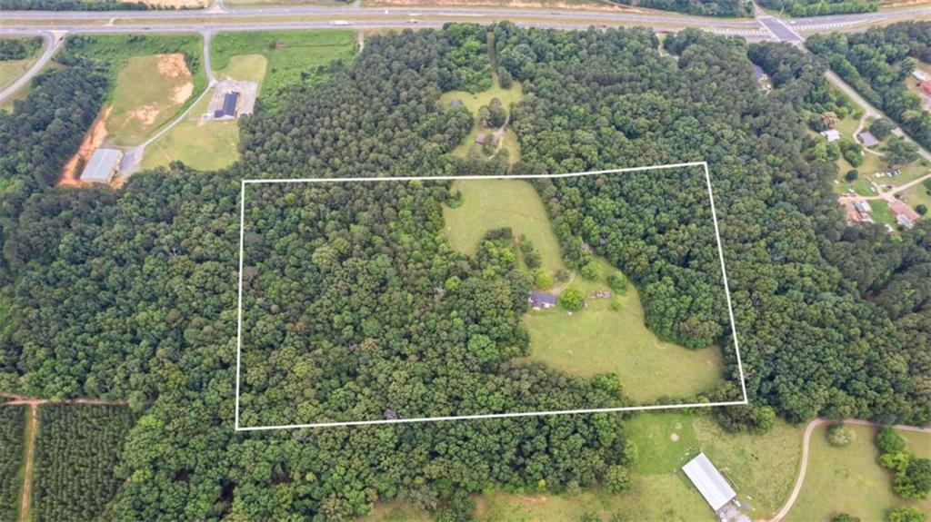 A unique opportunity awaits in Cedartown, where this 20+/- acre property, with new survey features a 1646 sq ft home in need of renovation. The property's picturesque land and tree-lined surroundings ensure maximum seclusion. With numerous possibilities for revitalization. Breathtaking pasture land and views from anywhere on this property, explore various options with an amazing renovation opportunity! Roof replacement in 2023 and a shed are additional highlights. Seller is administrator of estate. Use caution while viewing home, do not walk on back porch. Wasps on property, proceed with caution. All information deemed reliable, buyer to verify*