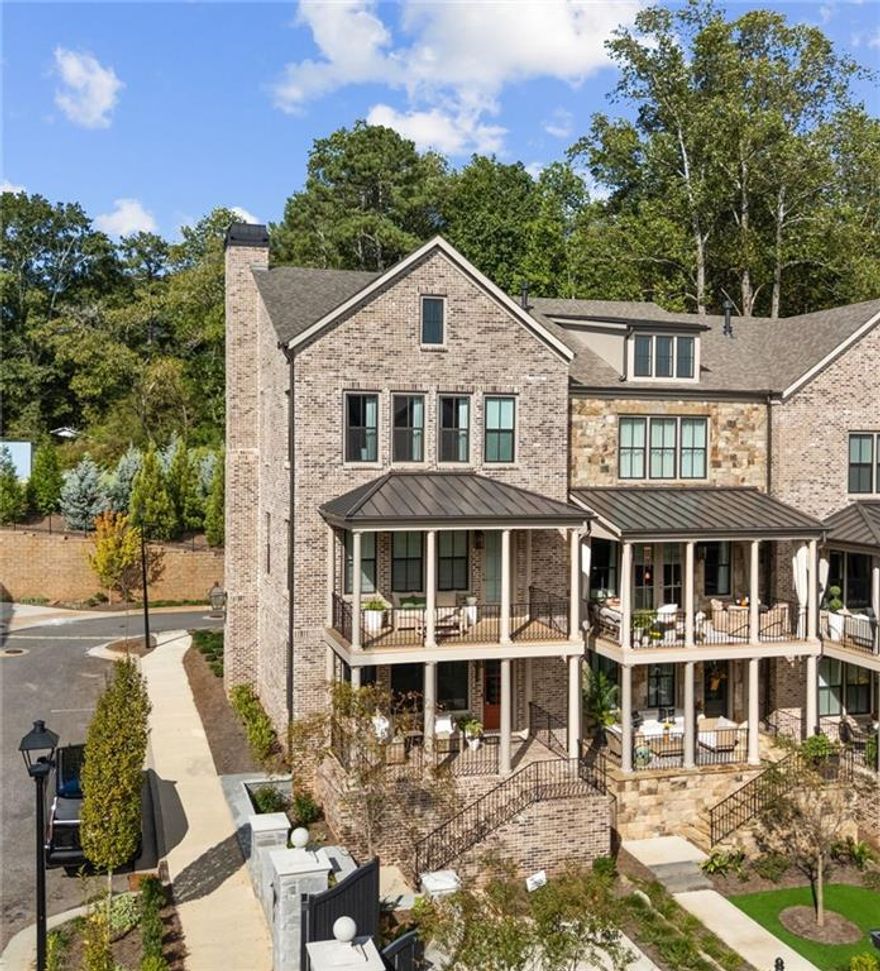 There are homes that check boxes... and then there are homes that check every lifestyle desire. This one is the latter. From the moment you walk up, the double front porches set the stage for a life of effortless elegance. Picture yourself starting the day with coffee in hand, overlooking the courtyard as the neighborhood wakes up. In the evening, a glass of wine upstairs on the primary porch as the city lights twinkle in the distance. Inside, sunlight dances across wide blonde hardwoods, elevating a palette of quartz, champagne fixtures, and custom lighting that feels more boutique hotel than suburban townhome. The open-concept kitchen, dining, and living space flow together seamlessly, making entertaining as natural as breathing. Upstairs, the primary suite is a sanctuary with a closet so generous it whispers promises of never fighting for hanger space again. Guests are equally cared for with spacious secondary bedrooms, while the finished terrace suite flexes into the perfect office, gym, or weekend retreat. This isn’t just square footage. This is freedom with finesse, an end-unit with unmatched width, thoughtful separation, and a future-proofed elevator shaft that makes “forever home” more than a possibility.



And then there’s the location. Nestled between Avalon and Downtown Alpharetta, you’ll never choose between a five-star dinner or a boutique shopping spree, you’ll simply decide which direction to walk.



For the empty nester or single with sophistication, the executive seeking low-maintenance luxury, or the buyer who refuses to compromise on style, this townhome is more than a place to live. It’s a statement.