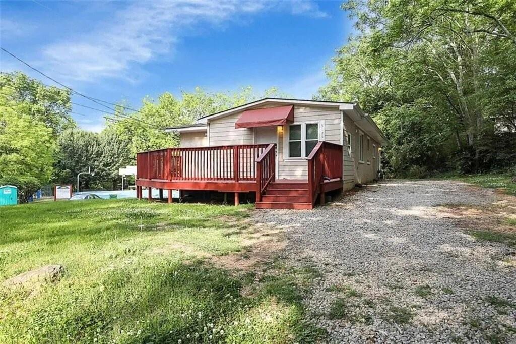 RENT TO OWN OPTION Move-in ready ranch on almost an acre overlooking a park with its own basketball court! Inside: bright open layout, real hardwoods, fresh paint—just unpack. Three roomy bedrooms share an updated bath; the eat-in kitchen flows to a sunny deck that watches the game next door. Flat, sprawling yard offers space for gardens, an ADU, or future expansion. Walk ten minutes to 18-acre Starr Park with pool, trails, and sports fields; hop on I-75/I-285 or reach Hartsfield-Jackson in under 15 minutes. New builds and estate lots nearby are asking more than this listing price, making this land-rich home a smart buy today and a growth play for tomorrow. No HOA, RS-65 zoning. See it—own it—before someone else does!