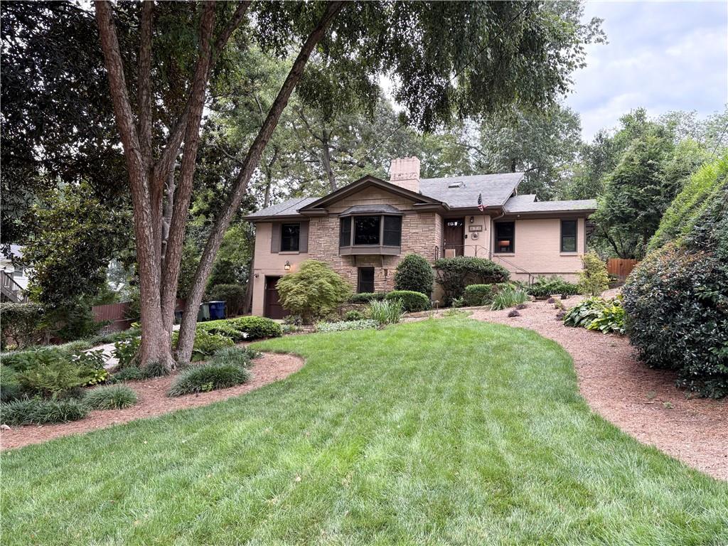 Charming 1950's Bungalow conveniently located between Buckhead and Midtown. Your lease will include high-speed fiber internet, landscaping and security monitoring. Entering into this lovely well maintained home you will be welcomed by a large living room with fireplace and bay window overlooking your pristine yard. Large dining room and updated kitchen finish off the main living area. Down the hall you find your three secondary bedrooms and a full bath. Upstairs is a bright loft style primary bedroom with a double vanity en-suite bathroom. In the basement you will find a a couple finished areas with a full bath that can be used as a entertainment area, game room even a bedroom. Also in the basement is a large utility room that offers easy access to your mechanical equipment, laundry and storage. One car garage with EV charger and workshop finish off the downstairs. Out back you will find a large attached sunroom with access to multiple outdoor entertainment areas, Cozy stone fire place overlooking your spacious treelined yard. Located close to City Parks, the North Beltline, Jones Golf Course, Bitsy Grant Tennis Center, Piedmont Hospital, shopping and dining options. Cats Only