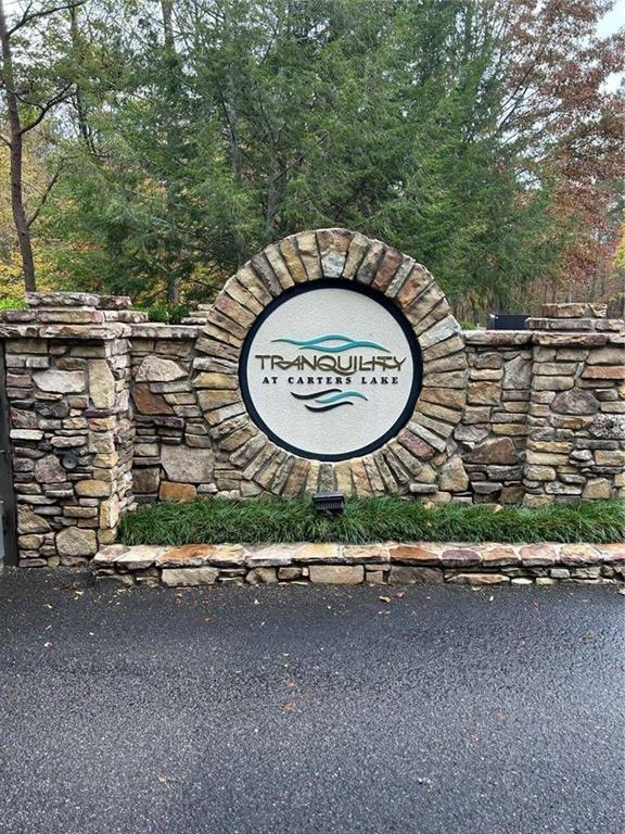 Corner Lot 184 in Tranquility at Carters Lake – Ready to Build! Ellijay, GA (Gilmer County)
Discover the perfect canvas for your dream home in the highly sought-after Tranquility at Carters Lake community!
This prime corner lot is ready for you to build on and comes completely with underground utilities, public water, and electricity readily available. There is also a fire department just outside of the gate, and two fire hydrants feet from the property, which could get you better insurance rates.
This gated community offers all paved roads, nature trails, a playground, and a pavilion area. All of this makes it easier to start your next chapter in the beautiful North Georgia mountains.
Enjoy access to Carter's Lake Boat Ramp—just minutes away—for endless days of fishing, boating, and outdoor fun. Need storage? Convenient dry boat storage units are also available nearby, making lake life hassle-free.
Nestled in nature yet only minutes from downtown Ellijay, and 70 miles north of Atlanta. You’ll have the best of both worlds: peaceful mountain living with quick access to shopping, dining, and entertainment, and close enough to Atlanta to enjoy a day trip!
Don't miss this rare opportunity to build in one of Ellijay’s premier lake communities. Whether you're planning a full-time residence or a weekend retreat, this lot offers the serenity, space, and lifestyle you've been searching for!
Location: Tranquility at Carters Lake, Ellijay, GA
tranquilityatcarterslakeownersassociation
Lake Access | Boat Storage |Underground Utilities |Scenic Surroundings
Your mountain getaway begins here!