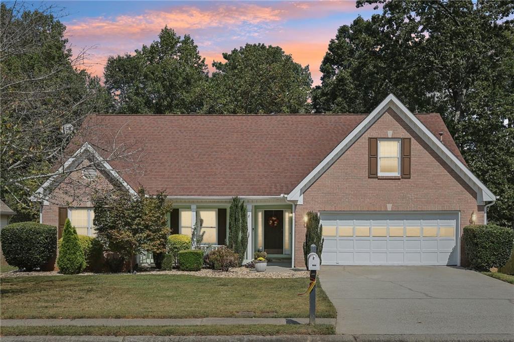 Charming and beautifully updated ranch home in a prime Lawrenceville location just five minutes from downtown, with easy access to shopping, dining, and major interstates. Nestled in a nice and quiet neighborhood, this well-maintained property features a cozy stacked stone fireplace framed by custom wood bookshelves, elegant tray ceilings in the living room, dining room, spacious primary suite, and oversized bedrooms that offer comfort and flexibility. The upgraded kitchen boasts granite countertops, tile backsplash, and stainless-steel appliances, while the upgraded bathrooms include solid surface vanities and modern finishes. A bright sunroom overlooks the private, fenced backyard—perfect for entertaining, gardening, or play. The open and flowing layout is enhanced by hardwood floors, window blinds throughout. The property also offers a large-capacity two-car garage and an extended driveway that accommodates up to four additional vehicles. Recent improvements include a new HVAC system (2021) and water heater (2022). All appliances are conveyed, including washer and dryer. With no mandatory HOA fees and move-in ready condition, this gem won’t last long—schedule your showing today! Please look for the 3D TOUR and VIDEO links/Icons