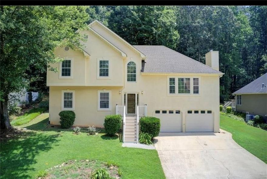 Move-in ready and filled with space for everyone! This 4-bedroom, 3-full bath home features two spacious living areas, a generous dining room, and a large kitchen with stainless steel appliances—washer and dryer included. The fully finished basement offers a complete in-law suite with its own full bath, living space, and a kitchenette, making it perfect for extended family, guests, or a private retreat.

Enjoy the convenience of a two-car garage with plenty of extra storage. Outdoors, relax on the beautiful balcony or make the most of the flat, fully fenced backyard. Located just minutes from shopping, restaurants, and entertainment in Town Lake, and Down town Woodstock this home combines comfort, convenience, and charm.