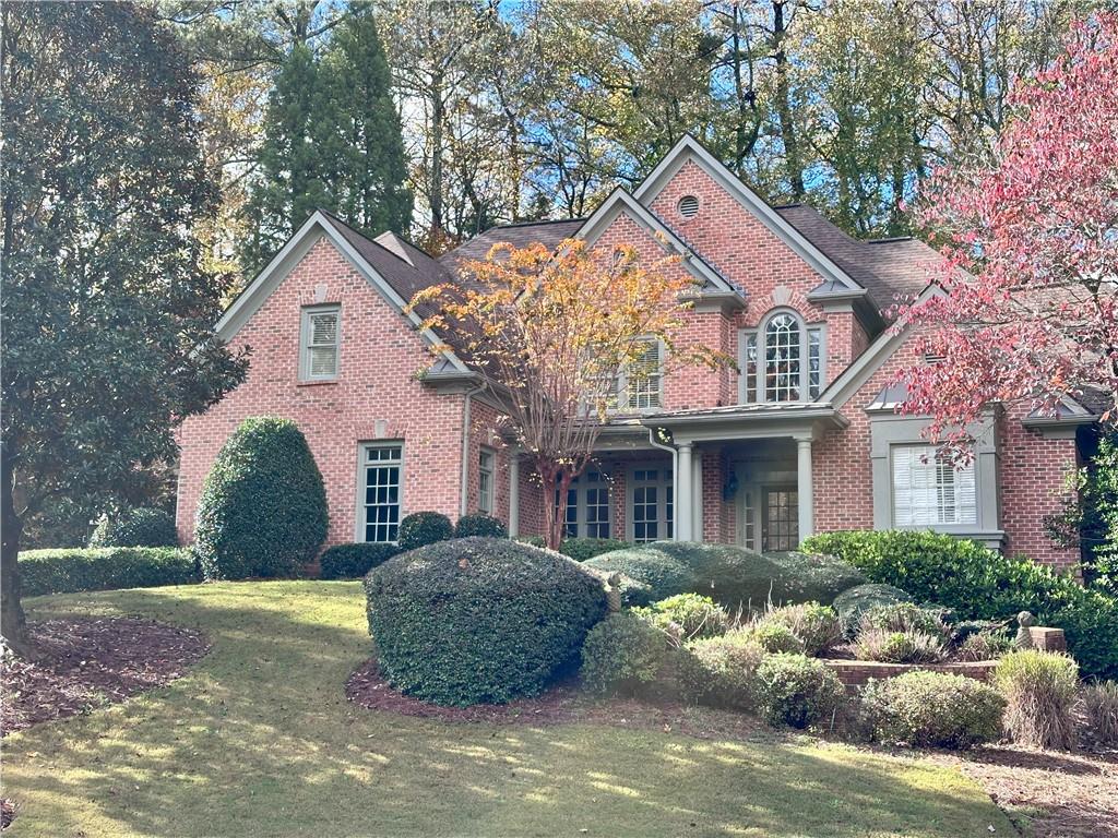 Indulge in the epitome of luxury living with this magnificent estate nestled in the coveted gated guarded prestigious Sugarloaf Country Club featuring master on main home at such a lucrative price with neutral tones has a true transitional style through out, boasting one of the most seamless floor plan in the community. Gorgeous craftsmanship on this 4 sided brick home. This home is freshly painted inside and outside ready to move in, sits alongside a cul-de-sac. It features 6 bedrooms, 5.5 baths. At the heart of this exquisite home lies the gourmet kitchen, adorned with abundant contemporary custom cabinet and solid counter tops and stone floors, stainless steel appliances, with center island, 6 burner Viking stove, Sub-zero refrigerator, Dishwasher, perfectly flowing into the welcoming family room. Very spacious Master suite on main with trey ceiling and sitting area, fully built out his and her closet. The Master bathroom has expansive beautiful quartz counter counter and makeup area, a large jacuzzi tub to pamper yourself, and walk-in shower. All bathrooms with newer Quartz countertops and new contemporary faucets throughout. All high quality wooden plantation shutters throughout the house, all bedrooms with walk in closets fully built out. One of the Rooms upstairs serves as a Work from Home office. Wrought Iron Staircase, level private backyard is exceptionally large ready for a walk out pool with entertainment walk out patio. This home has been freshly painted. The laundry room is on the main level. The lovely 2 story family room has a cathedral ceiling, built-in bookcases, a fireplace – great for entertaining! The formal dining room seats 12. There is an abundance of natural light throughout. Optional Membership in TPC Sugarloaf offers PGA level 27 hole golf course, clubhouses, swimming pool, fitness center, playground, tennis courts and pickle ball courts. Great location! Close to a huge community park with running/biking track and sport fields. Minutes to shopping, dining, entertainment, and nearby Gas South Arena. An exquisite property for an executive lifestyle is a true masterpiece of functional elegance offering a harmonious blend of luxury and practicality sitting on a Quiet Cul-de-sac location of Sugarloaf Country club.