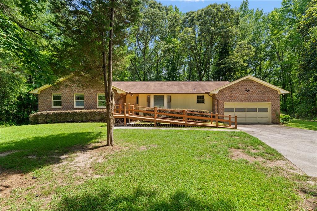 Welcome to 4967 Macland Road. Located on 2.49 private acres, this home has endless potential. This all brick, ranch style home allows for comfort, while the large unfinished basement provides a flex space for a workshop, additional storage, and direct access to the backyard. In addition to the walk out basement, there is a large deck and screened in porch perfect for entertaining. The large family room, dining room, and separate den allow everyone to feel connected while still having their own space. 4967 Macland Road is filled with endless opportunities to imagine and design and make this house your own.
