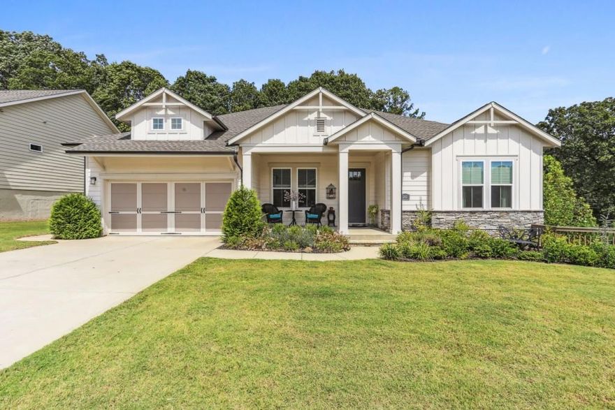 Fabulous Ranch Home in the Sought-After Active Adult Community of Heritage at Towne Lake - Woodstock Welcome to one of the few homes in this desirable community built on a finished basement! This meticulously maintained residence offers effortless one-level living complemented by a fully finished daylight basement, featuring 10-foot ceilings, 8-foot doors, and zero-entry doorways for easy accessibility.The chef's kitchen is a true delight, showcasing a large island with seating - perfect for entertaining. The family room features a cozy fireplace, while the dining area opens to an extended covered porch overlooking the beautifully  fenced backyard.The spacious owner's suite boasts a luxurious en-suite bath with double vanities, a walk-in shower, and a large closet. Two additional bedrooms, each with their own private bath, are thoughtfully located in separate wings of the home - ideal for visiting guests. A flex room off the front hallway is currently used as an office.Downstairs, the finished daylight basement provides an additional bedroom, full bath, and multiple versatile rooms perfect for recreation, hobbies, or extra storage. (Note: the tax records do not reflect the finished basement square footage.) Enjoy exceptional community amenities just a short walk away - including a clubhouse, pool, fitness center, pickleball courts, and community garden.Ideally situated near shopping, dining, hospitals, and downtown Woodstock, with easy access to Highway 575 and Highway 75, this home offers both comfort and convenience. Don't wait - this could be your dream home!