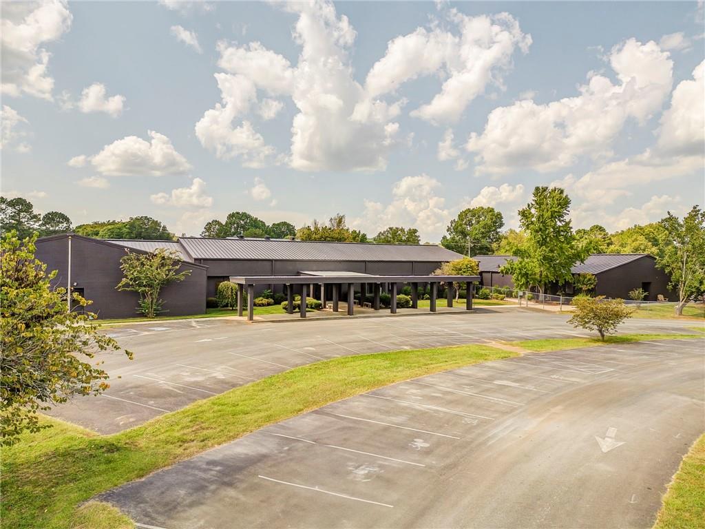 Former Cave Spring/Floyd County Elementary School with approximately 60,000 =/- sq ft of space including classrooms, cafeteria and kitchen - Operate your business with ease in this spacious one level building. Just a few steps from restaurants and shopping in downtown Cave Spring. Come check out this quaint little country town and move your business here. Deed restrictions do exist.