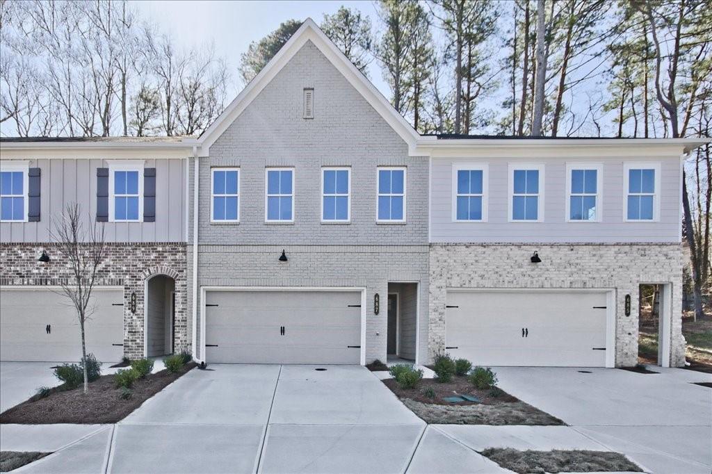 Ask about our 4.99% financing & incentives! Traton Homes, Floorplan-Brooks, Elevation-H, Ready-March, is proud to present "River Walk Place", a brand-new community conveniently located near downtown Lawrenceville, GA. Our Brooks "H" model is a stunning new construction starting in the high $390s in this highly desirable location.
This beautifully crafted home features 3 bedrooms, 2.5 baths, and an exceptional chef-inspired kitchen, complete with **QUARTZ countertops**, **Whirlpool stainless steel appliances**, **crown molding** on the main level and primary bedroom, and an oversized island. The kitchen is enhanced by **white cabinetry**, **tile backsplash**, and a **gas oven range**.
The open-concept family room invites you in with a sleek modern **linear fireplace**, creating a cozy atmosphere for relaxation. Gorgeous **LVP floors** flow throughout the main level, including the stairs and loft area.
Upstairs, the expansive **primary suite** is a true retreat, boasting a luxurious private bath with a double vanity and a frameless shower. Two additional generously-sized bedrooms share a well-appointed bath, ensuring comfort and privacy for all. The upstairs loft is versatile, ideal for a study, home office, or cozy den. The laundry room is conveniently located upstairs.
Additional features include a **two-car garage** and easy access to **Lawrenceville Square**, **Mall of Georgia**, and major highways like I-985 and I-85.
Take advantage of up to **$5,000 in closing costs** from our preferred lender, which can be applied towards a rate buydown**. **All buyers must prequalify with our lender, regardless of who they choose for their loan**, and all incentives are tied exclusively to the preferred lender.