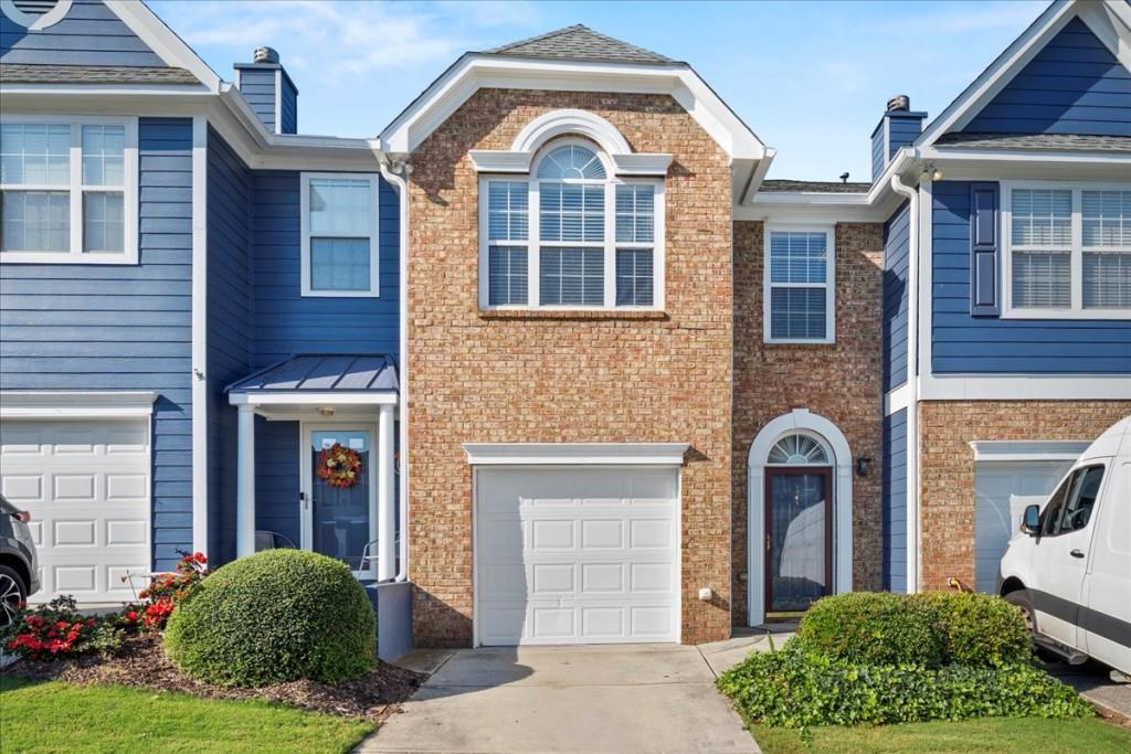 Welcome home to this 3-bedroom, 2.5-bath townhome in the sought-after Tide Water Cove Subdivision, Downtown Flowery Branch. Enjoy new flooring throughout, fresh paint, updated lighting, new water heater, and a fairly new HVAC. Natural light fills the home, which features a cozy fireplace, stainless steel appliances, an open floor plan, and a rear patio ideal for entertaining. The spacious primary suite offers a vaulted ceiling, walk-in closet, separate tub and shower, and double vanity. Additional bedrooms and laundry are conveniently on the same level. There's plenty of room for family, guests, or a home office. This home is walking distance to Fishtales Restaurant and Hideaway Bay Marina. With no rental restrictions and a competitive price, it will not last long.