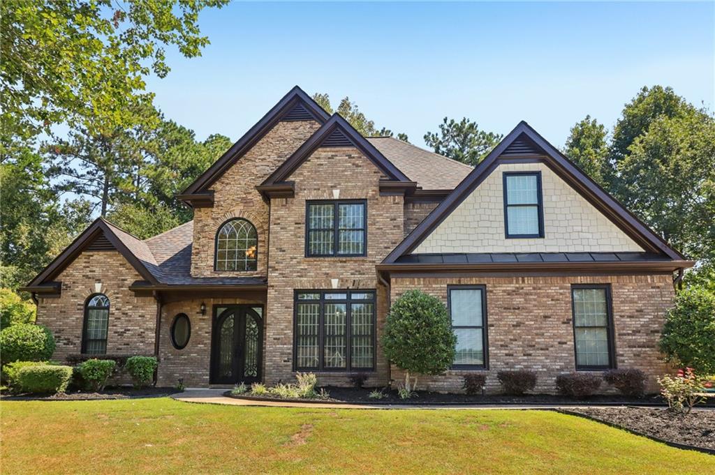 Welcome to this stunning European-style executive home, masterfully designed and truly in a league of its own! Tucked away in a picturesque cul-de-sac within the sought-after Whitestone Subdivision, this home boasts undeniable curb appeal with timeless architecture, manicured landscaping, and a sophisticated presence sure to turn heads. Step through the custom steel front door into a dramatic two-story foyer highlighted by wainscoting, majestic crown molding, elegant arches, and columns. Natural light pours in, accentuating the home’s fine craftsmanship and open-concept design.
This well-maintained 4-bedroom, 2.5-bath one of kind beauty offers a thoughtfully designed layout! Owner’s suite on the main level with spa-like bath, whirlpool tub, tiled shower, dual vanities, and oversized walk-in closets. Three spacious secondary bedrooms upstairs, including a Jack-and-Jill bathroom with double vanities. Gourmet chef’s kitchen with granite countertops, abundant cabinetry, walk-in pantry, and a cozy keeping room with fireplace. Formal dining room with soaring 10-foot ceilings, perfect for entertaining. Inviting family room featuring a stacked-stone fireplace and seamless flow to the private backyard retreat. Additional highlights include hardwood flooring, abundant storage, and a side-entry 2-car garage. Beyond the home, enjoy a vibrant community with resort-style amenities—walking trails, pool, tennis, clubhouse, playground, and more—all just minutes from shopping, dining, and conveniences. This home checks every box; luxury, comfort, and location! Don’t miss your chance. Schedule your tour today!
