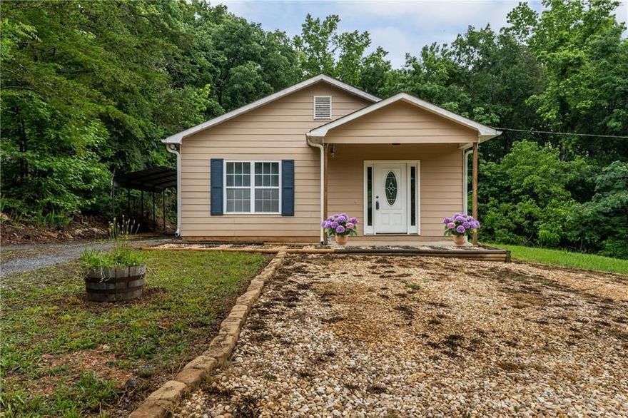 HUGE PRICE REFRESH! Discover this charming move-in ready bungalow ranch in Fairmount, Georgia — perfect for retirees, first-time homebuyers, or investors seeking a high-value property in a quiet, convenient location. This well-built 2-bedroom, 2-bath home combines comfort, quality, and timeless style at a price rarely seen in today’s market.

Step inside to find a warm and inviting interior with real hardwood floors flowing through the main living and dining areas. The open-concept kitchen connects seamlessly to the family space, creating an ideal layout for entertaining or relaxing at home. Luxury vinyl plank flooring in the kitchen and bedrooms makes the home both stylish and easy to maintain — perfect for those seeking a low-maintenance, carpet-free lifestyle.

Natural light fills every corner, highlighting the home’s cozy charm and spacious feel. Step outside to your beautiful deck overlooking a green, private backyard — a perfect spot for morning coffee or weekend gatherings. A metal carport provides year-round protection for your vehicle, and a secure underground storm shelter offers peace of mind during storm season. A concrete 11x11 pad is ready for your new outbuilding, workshop, or storage shed.

Located just 5 minutes from downtown Fairmount, 10 minutes from Calhoun, and 20 minutes from Canton, Jasper, and Cartersville, this home offers the perfect balance of small-town living with quick access to shopping, dining, and major highways. The property sits within an excellent school district and offers quality stick-built construction — not modular or mobile — all for well under $300,000.

Whether you’re downsizing, buying your first home, or adding to your rental portfolio, this thoughtfully maintained home offers unbeatable value and lasting comfort. Schedule your showing today — homes like this in Fairmount don’t stay on the market for long.

Bonus: FREE Home Warranty when using the preferred lender!